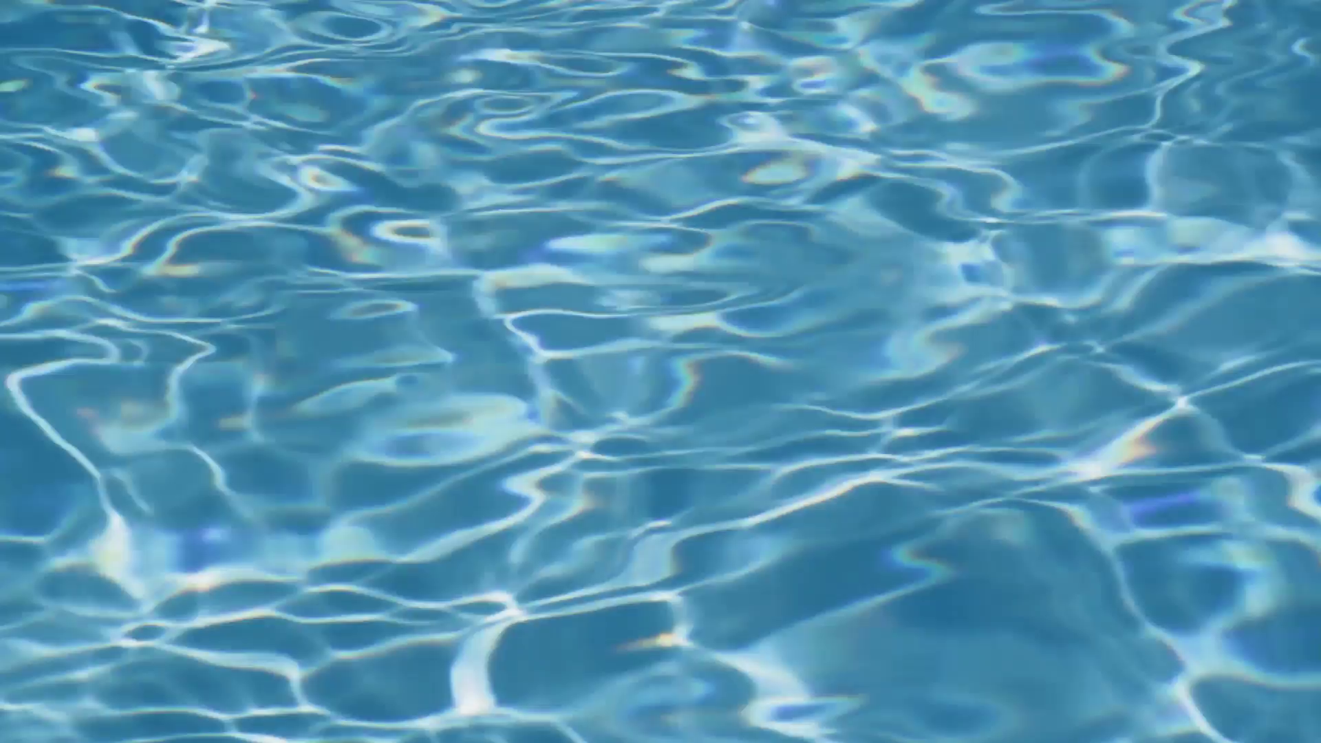 Closeup of sunny water in a clean, outdoor swimming pool. Stock ...