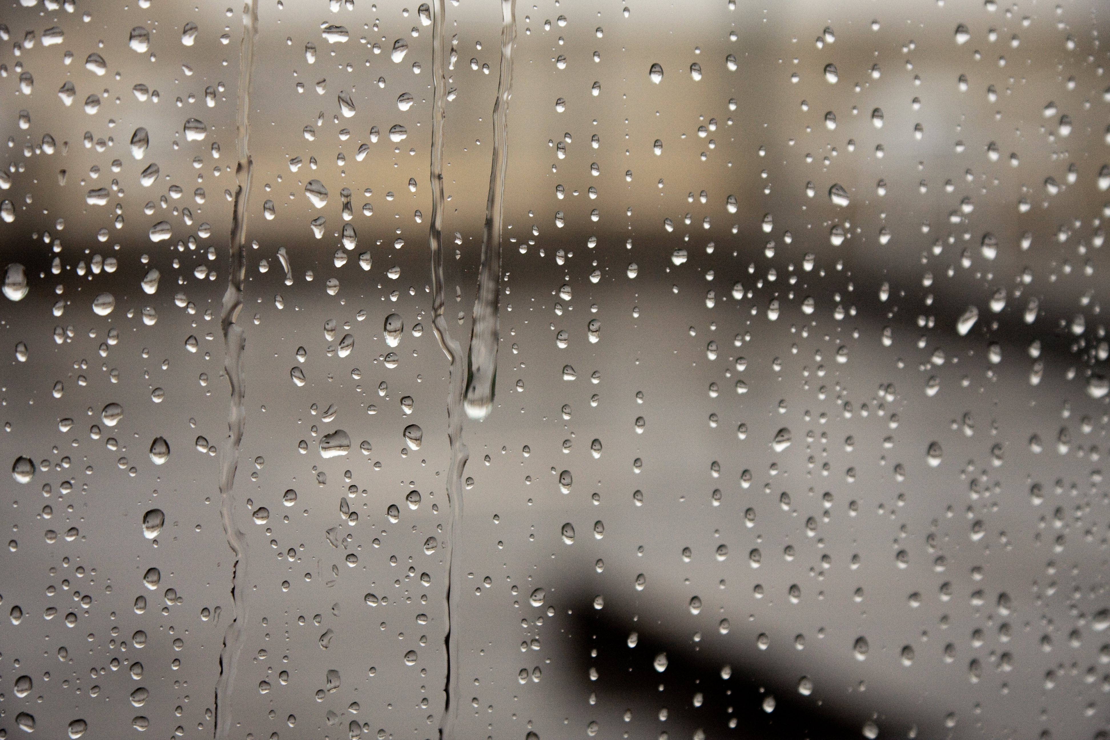 Rain water dripping over a window | photo page - everystockphoto