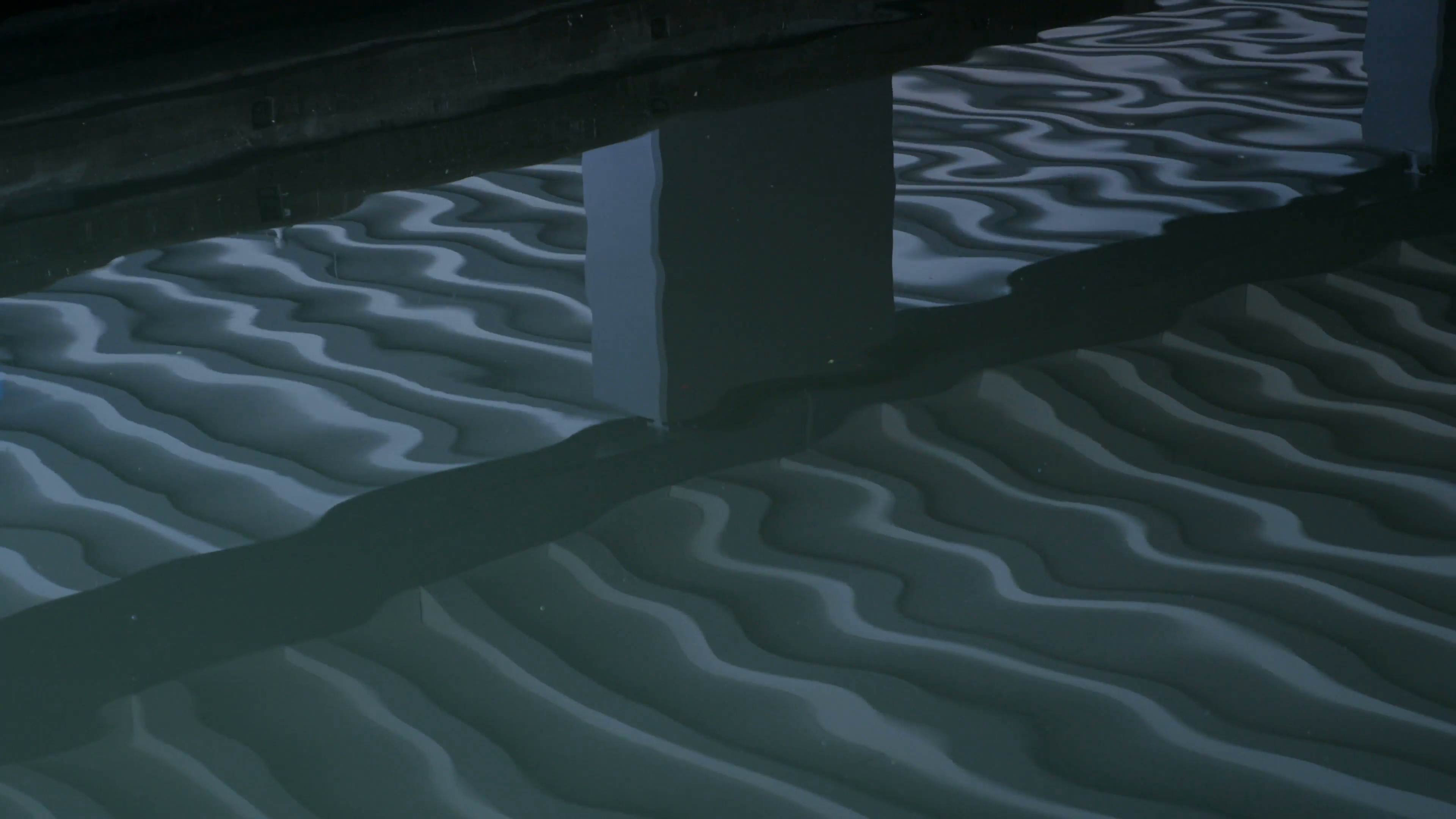 Green water ripples under bridge, abstract pattern. Motion ...