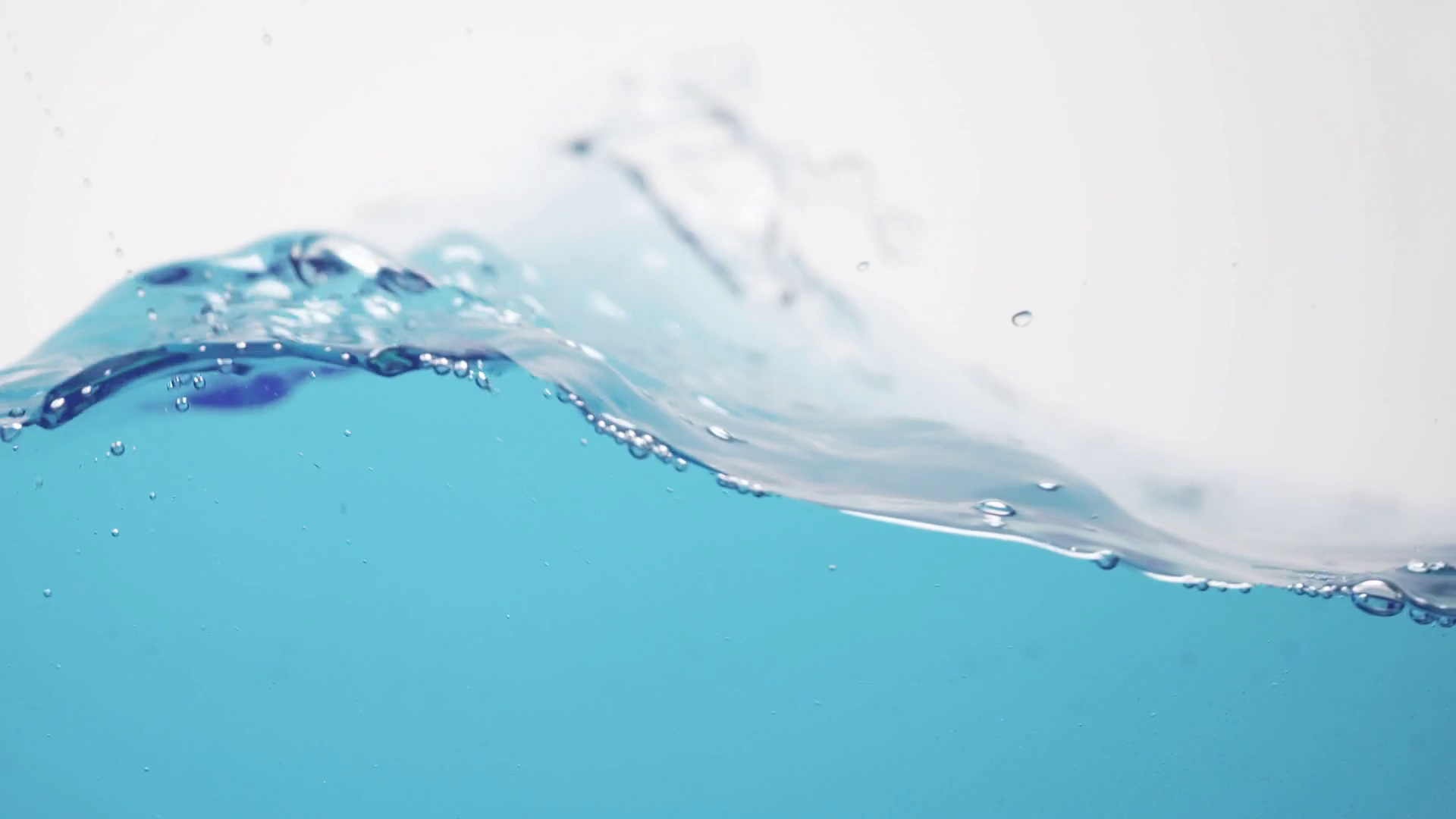 side view of blue toned water waves in slow motion, 180fps prores ...