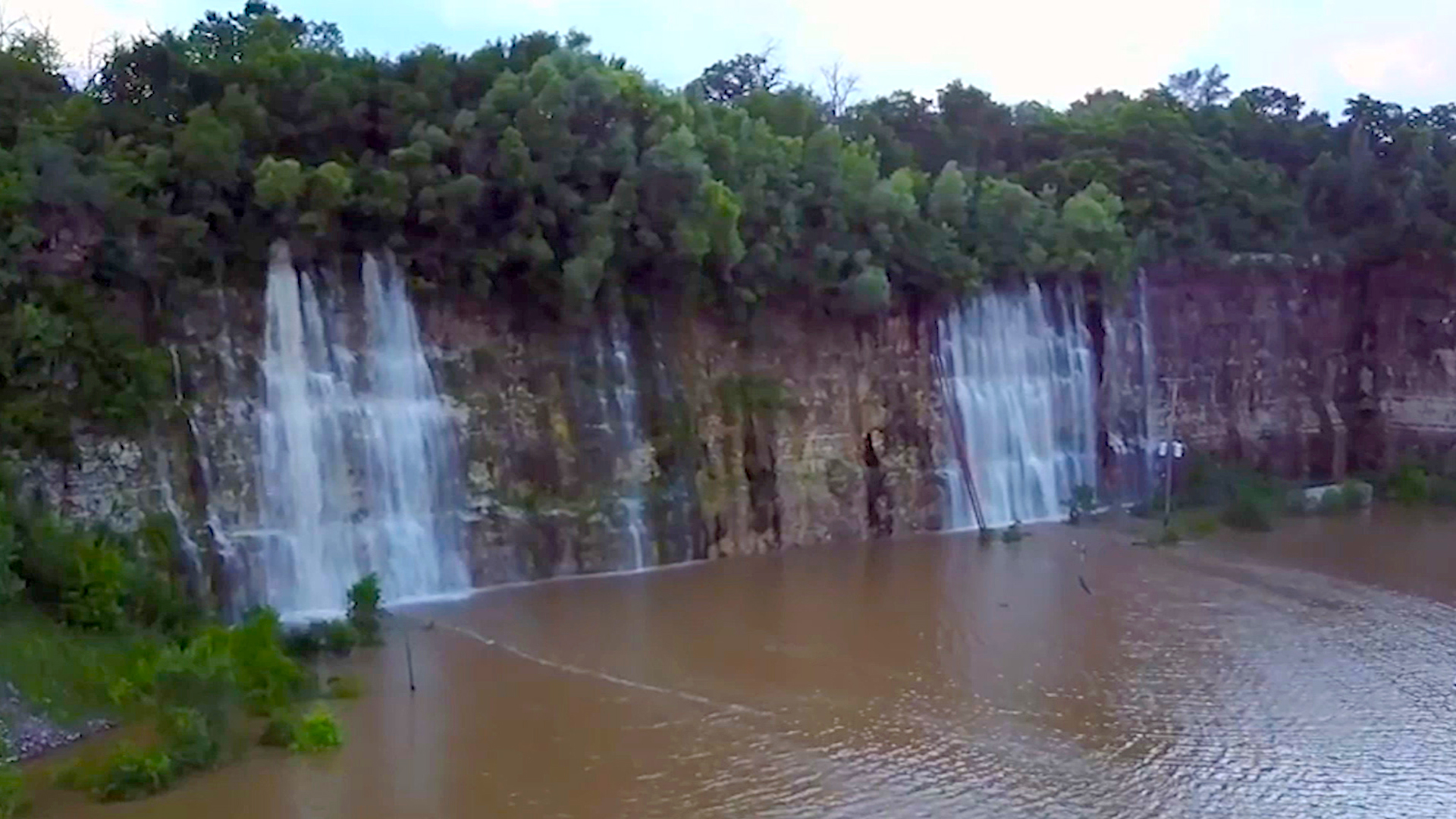 This Empty Quarry Transformed Into a Waterfall-Filled Lake