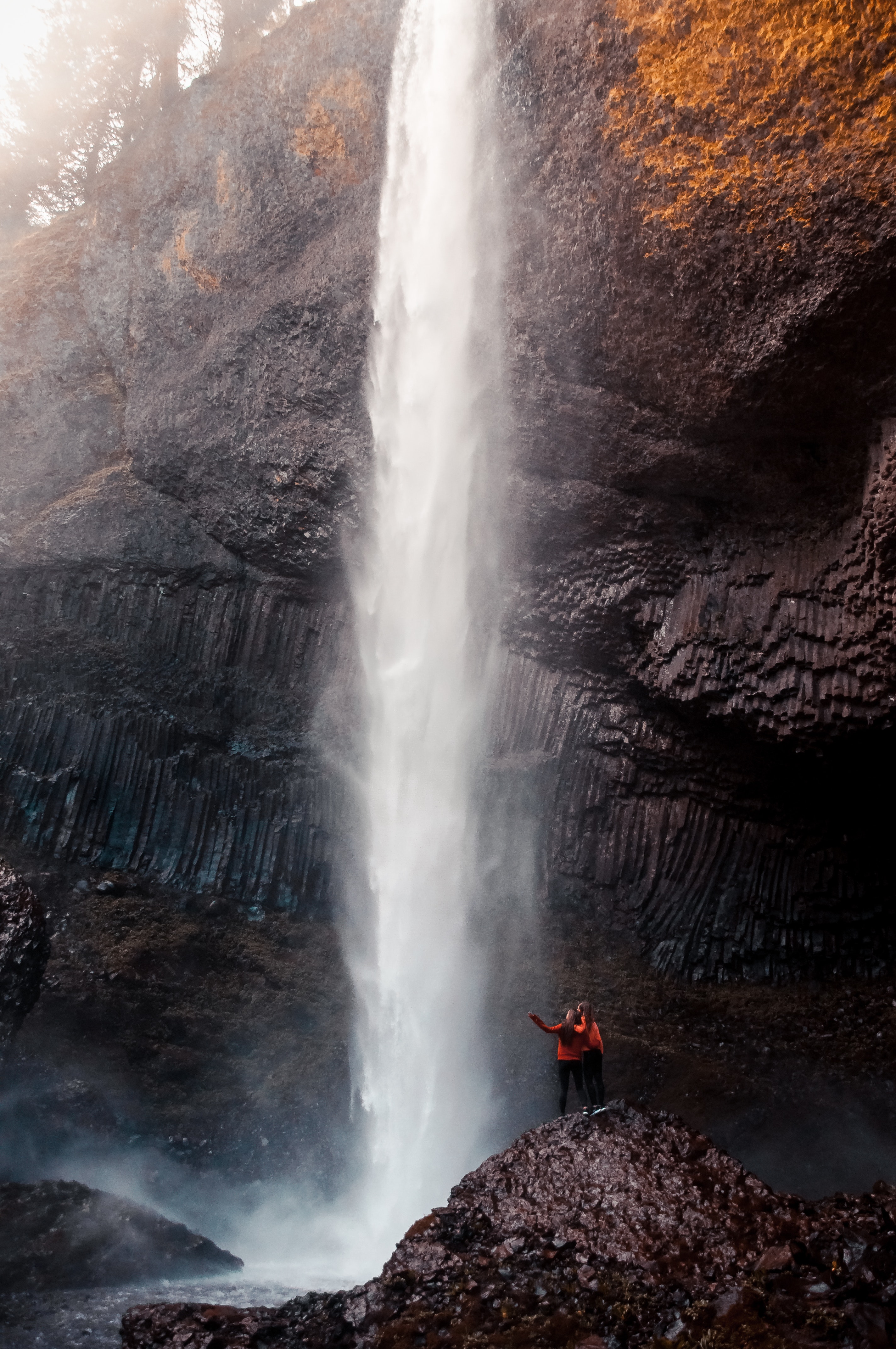 Two Man Beside Waterfall Taken At Daytime · Free Stock Photo