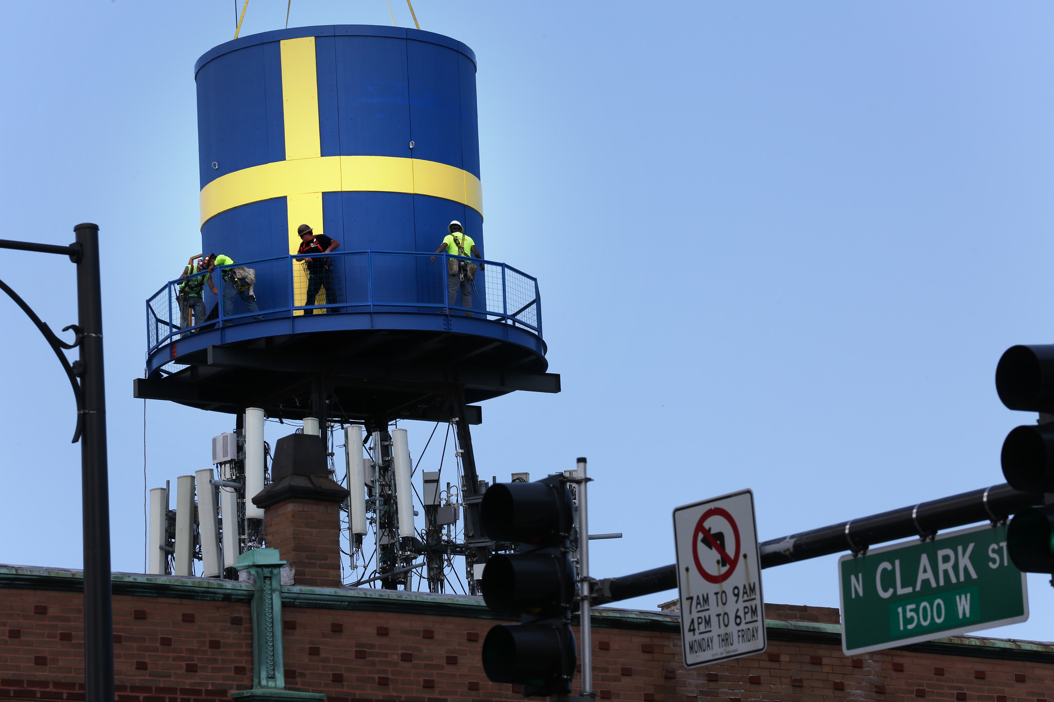 Replica water tower raised to roof of Swedish American Museum on ...