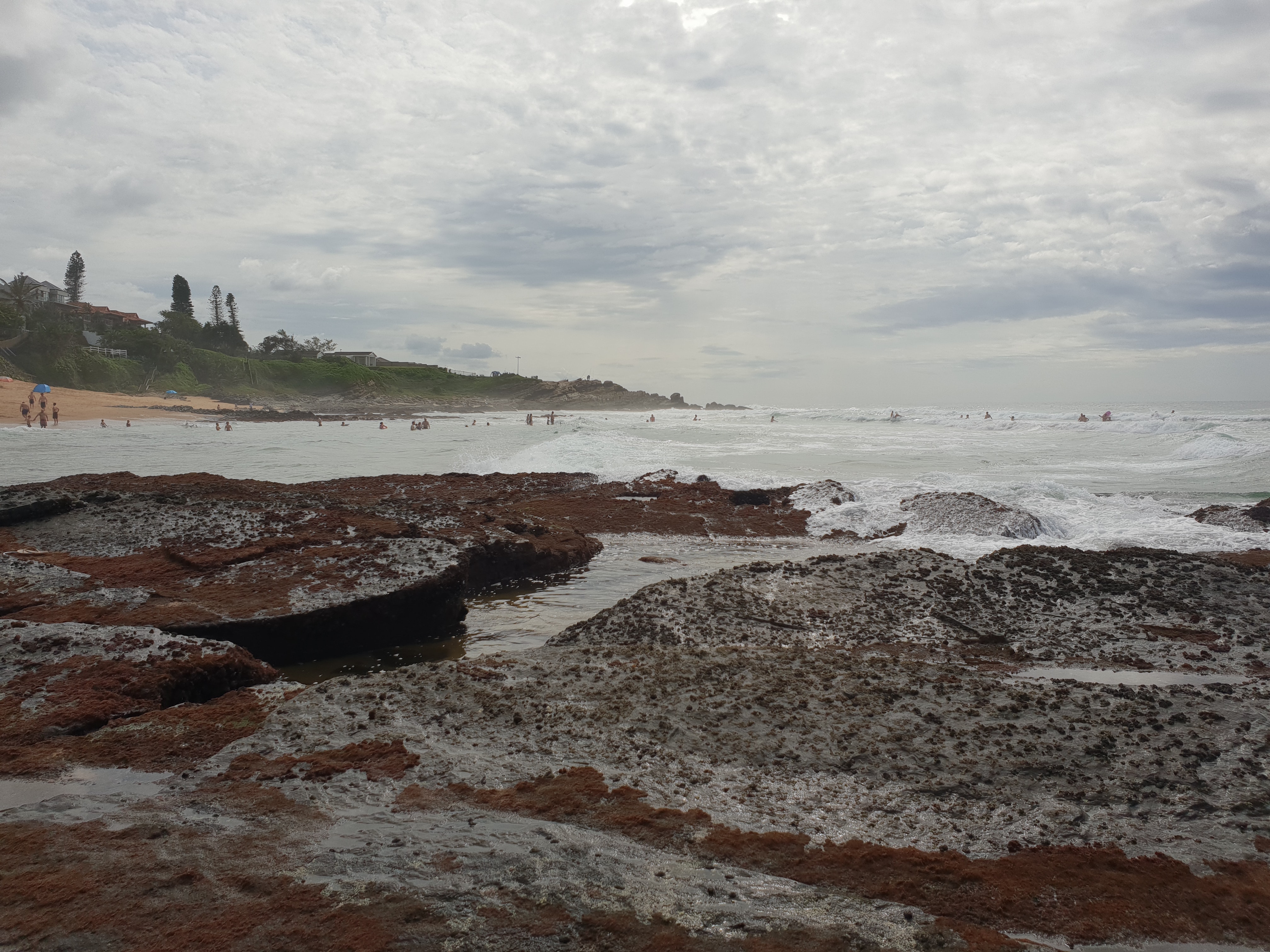 Waves crashing on the rocky beach photo