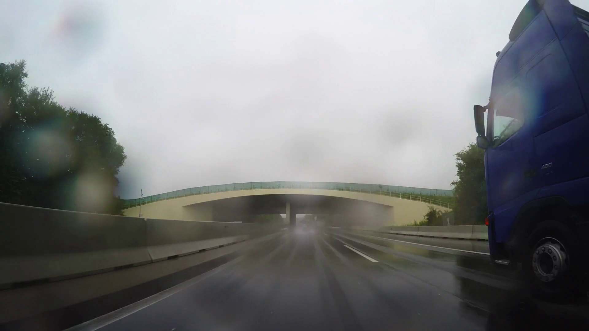 Daytime car travel point of view, highway lane wet road in Austrian ...