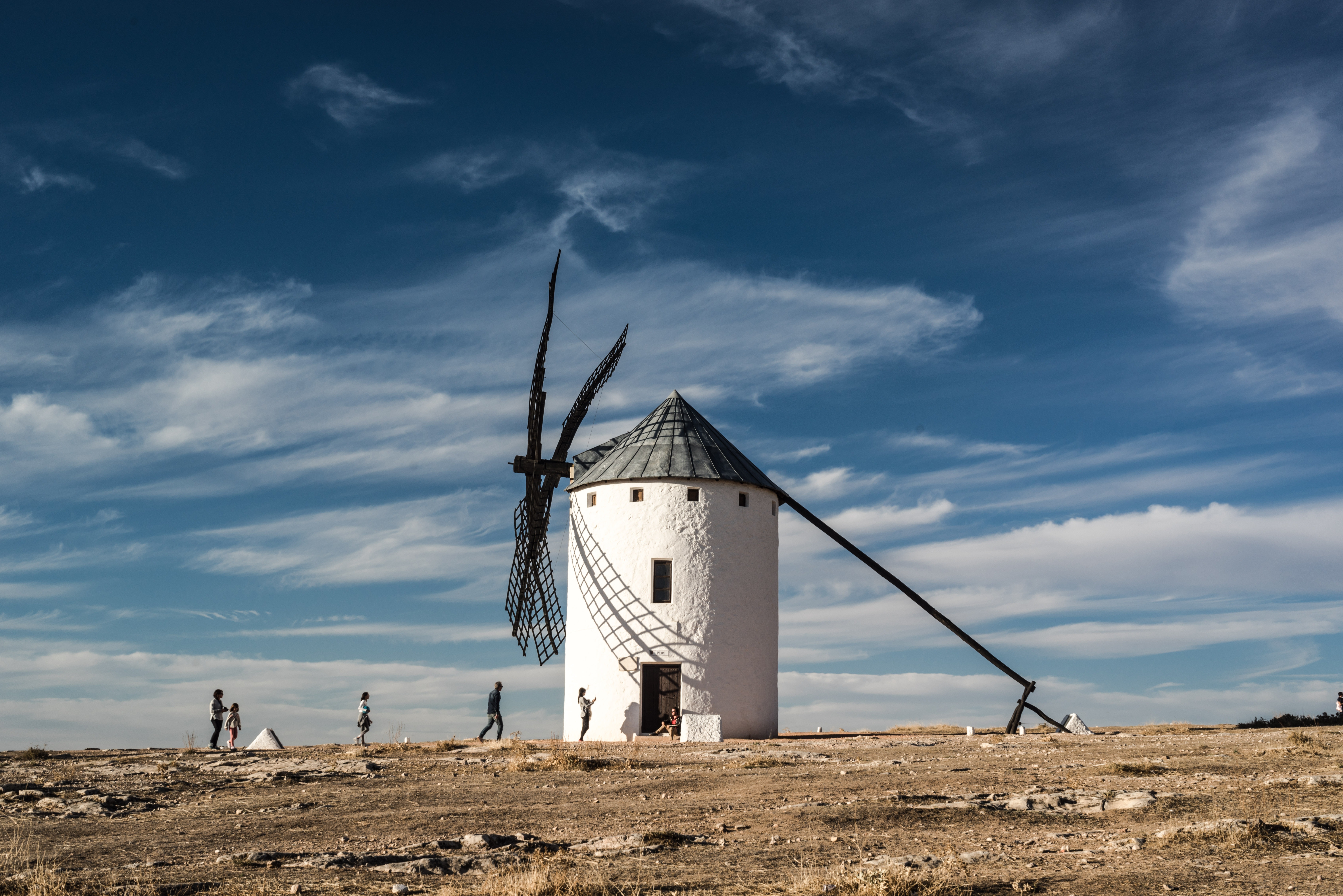 White and black windmill building photo