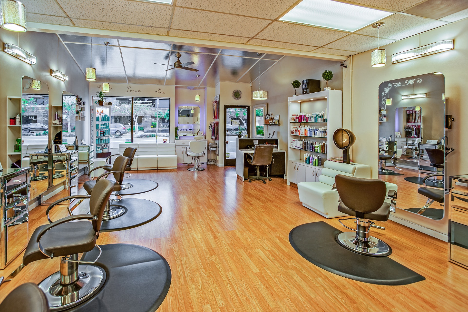 White and brown chairs inside a salon photo