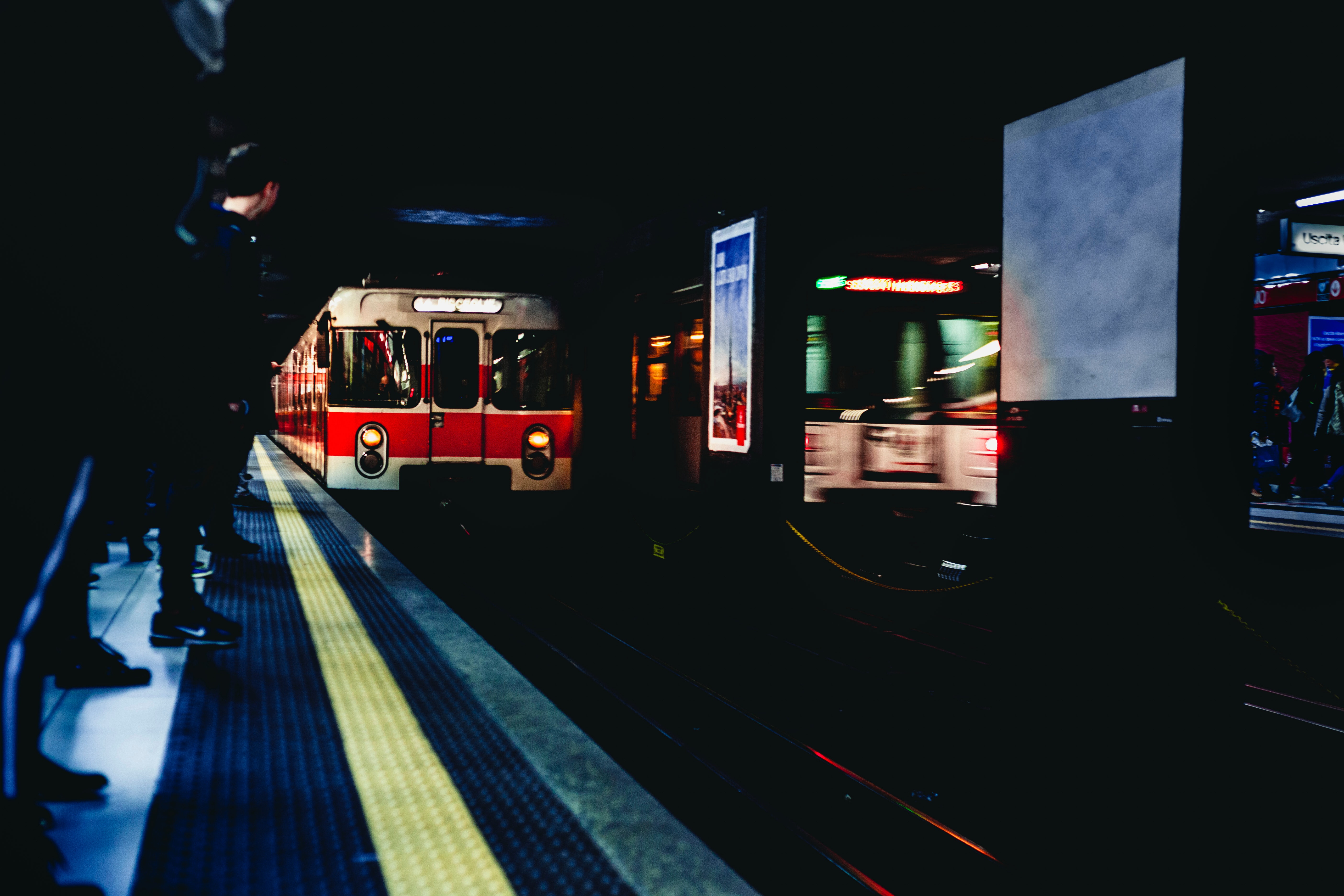 White and red train in underground photo