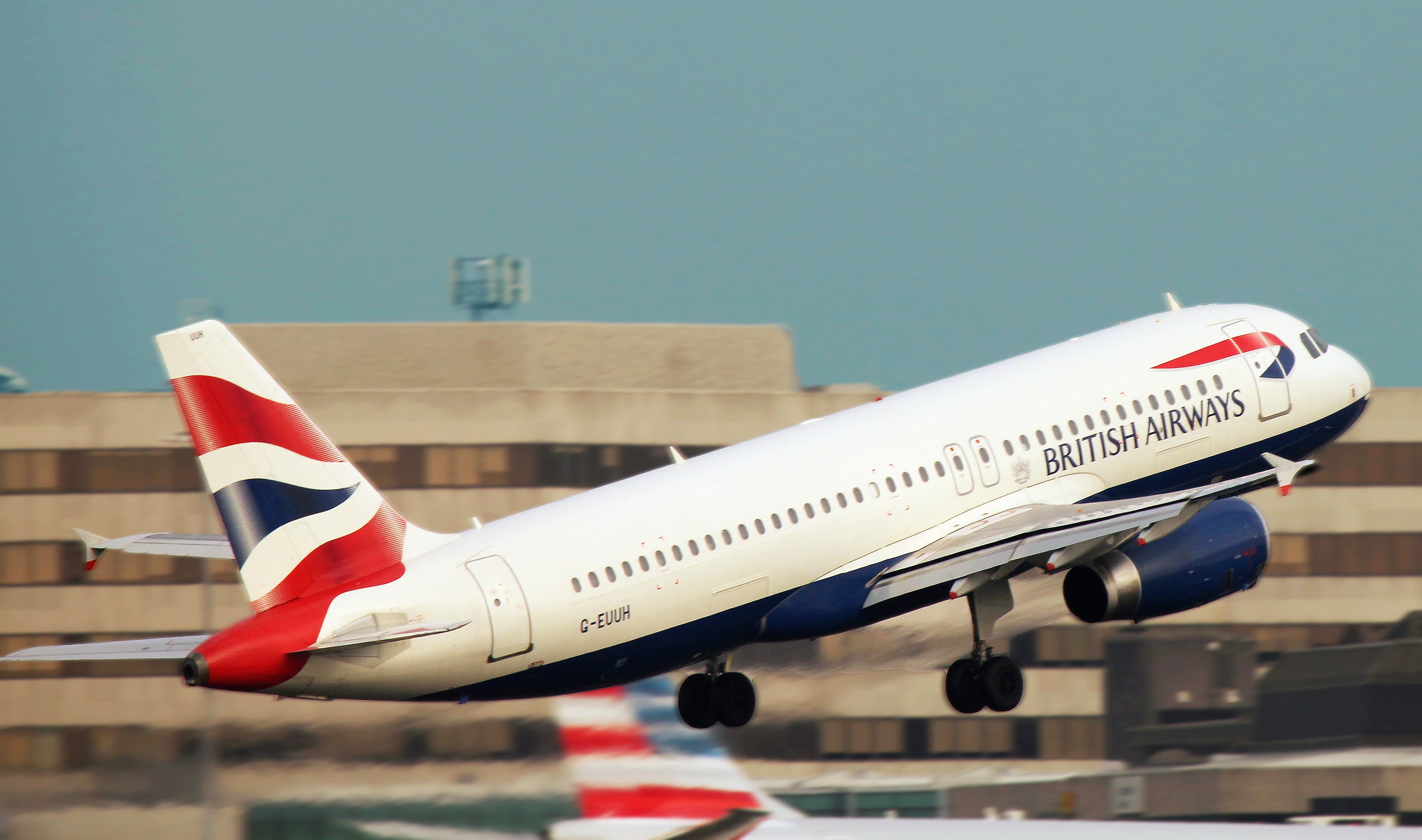 White british airways taking off the runway photo