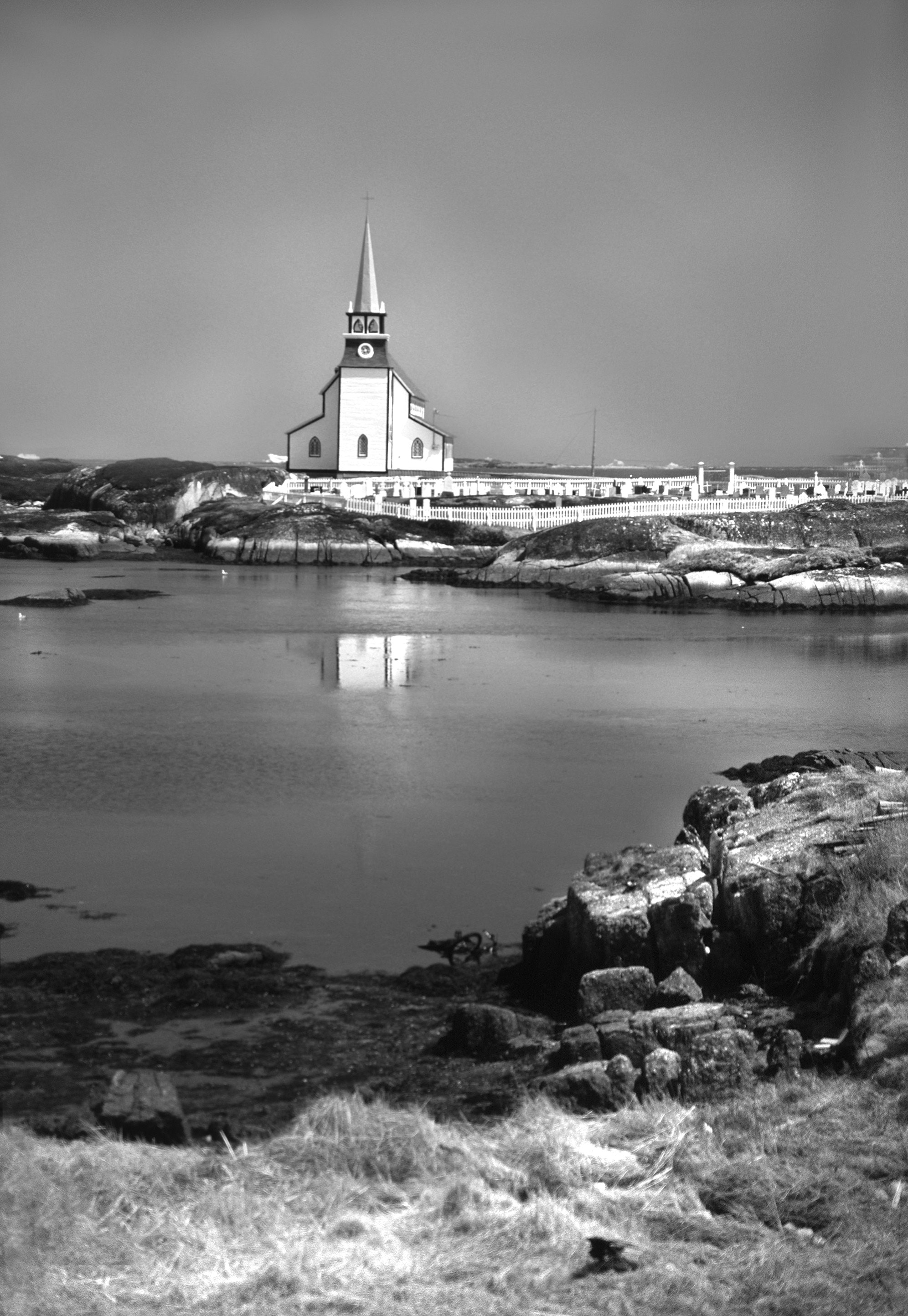 White church next to body of water photo