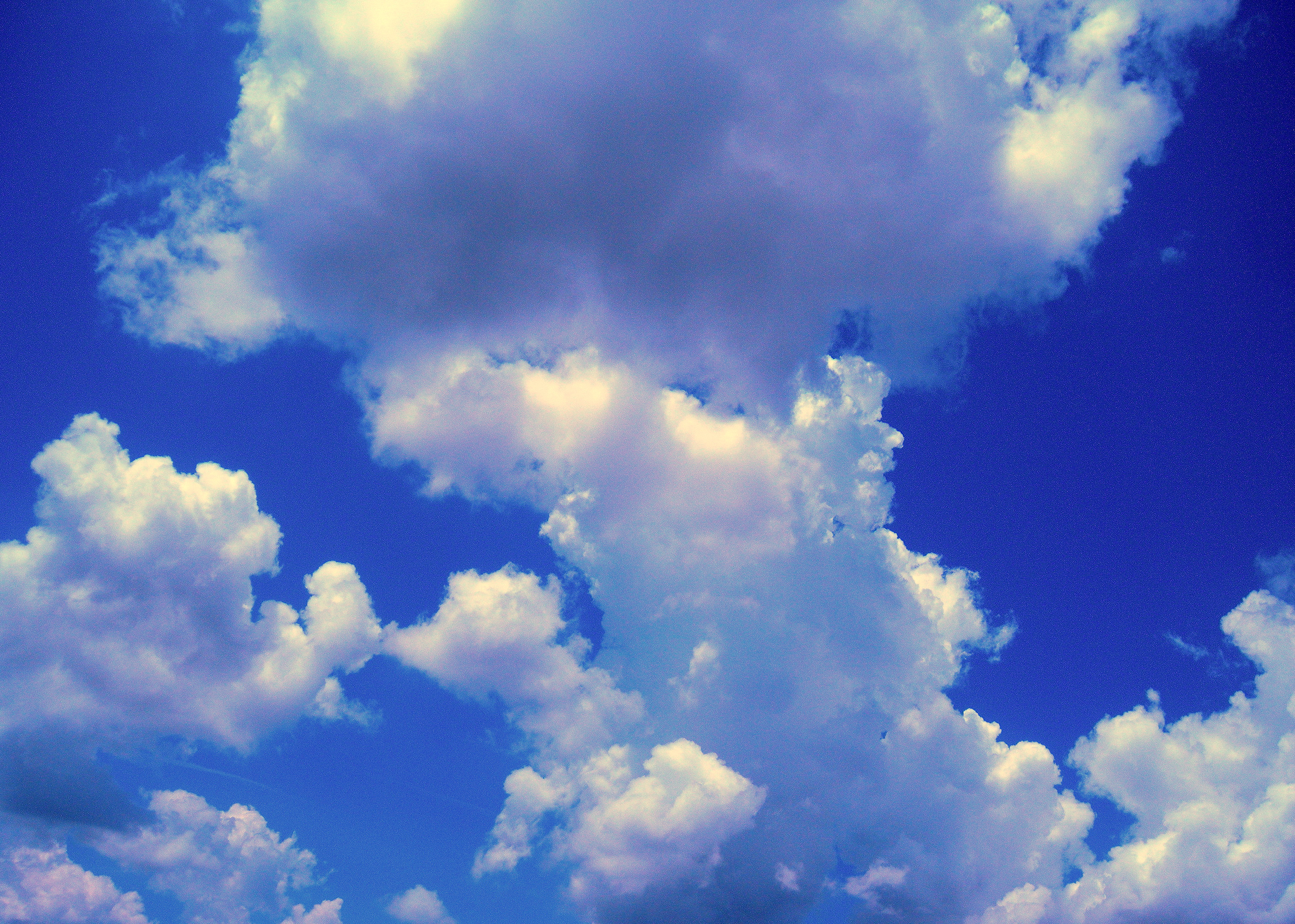 White clouds in blue sky photo