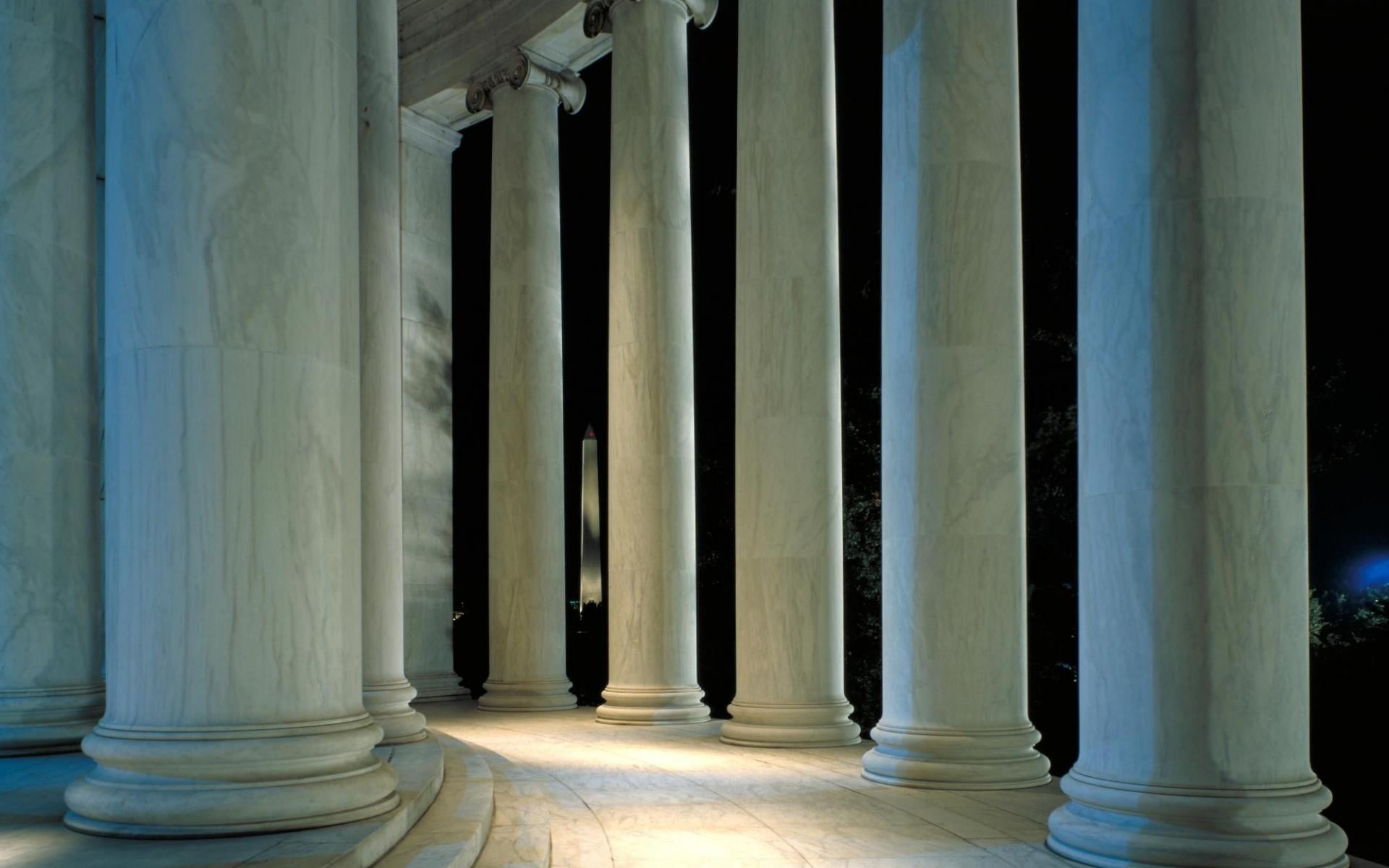 White concrete column pillars with lights during nighttime HD ...