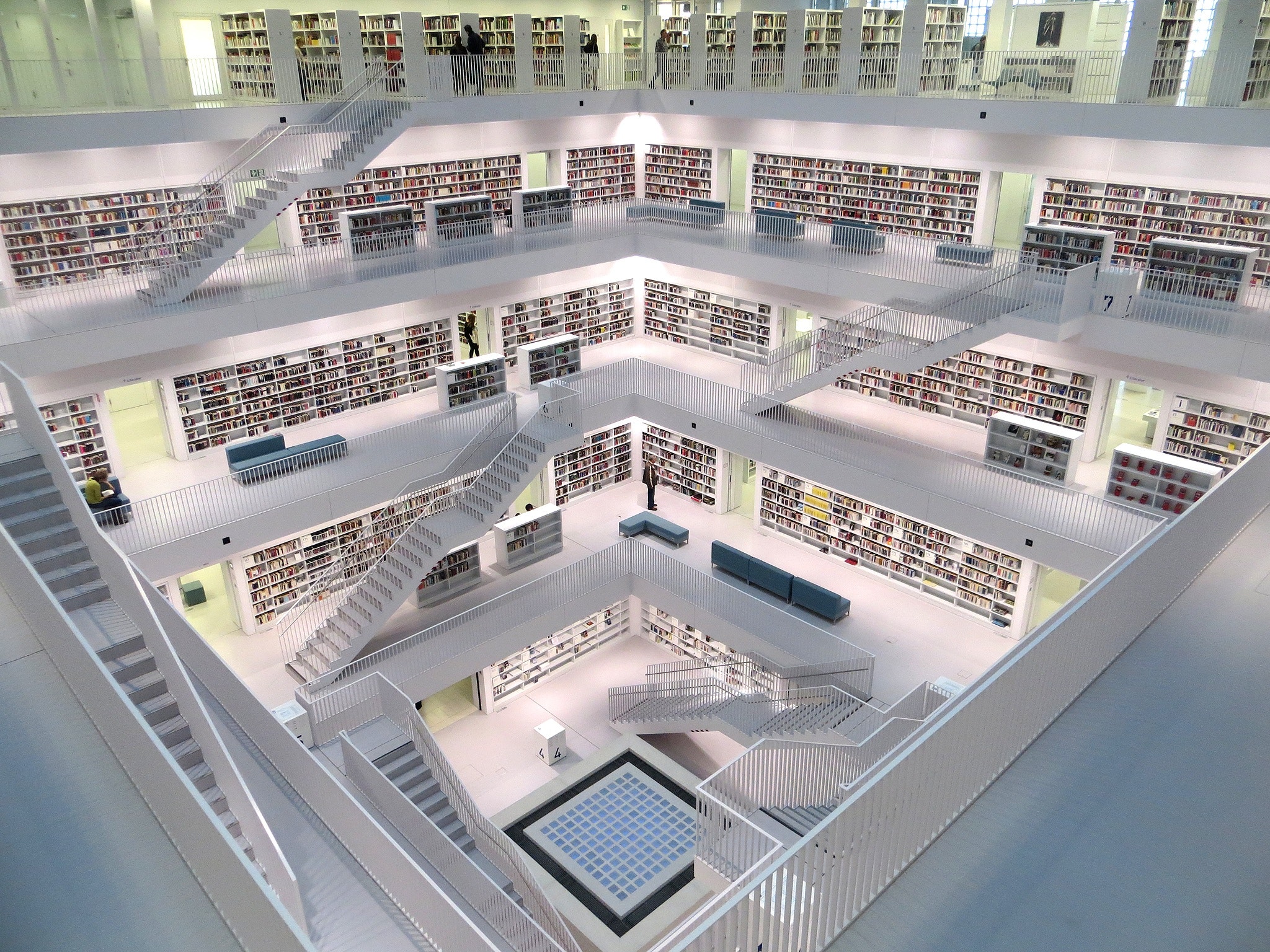 White concrete tall building with books photo