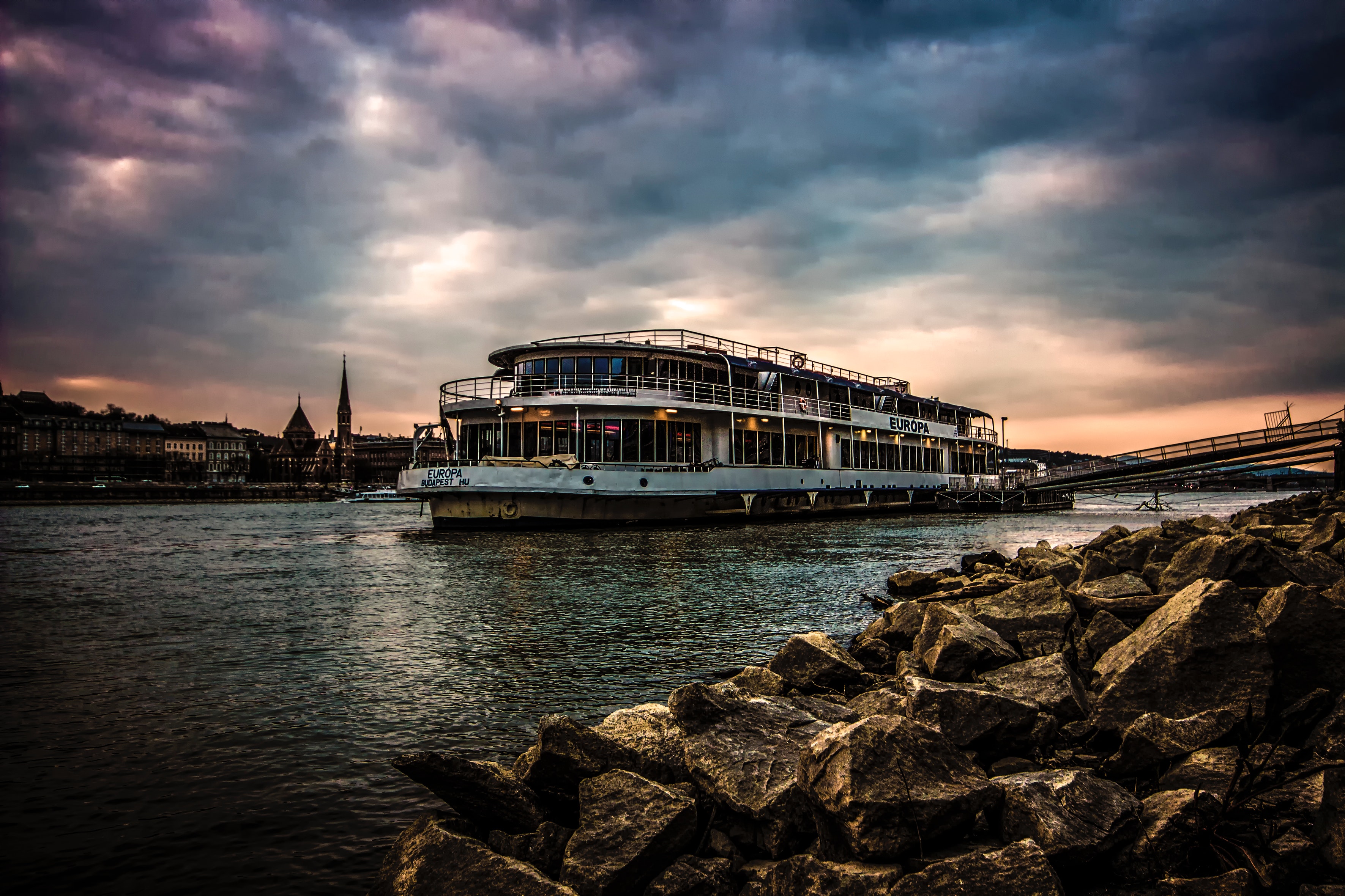 White Ferry Boat by Rocky Shore, Budapest, City, Cityscape, Clouds, HQ Photo