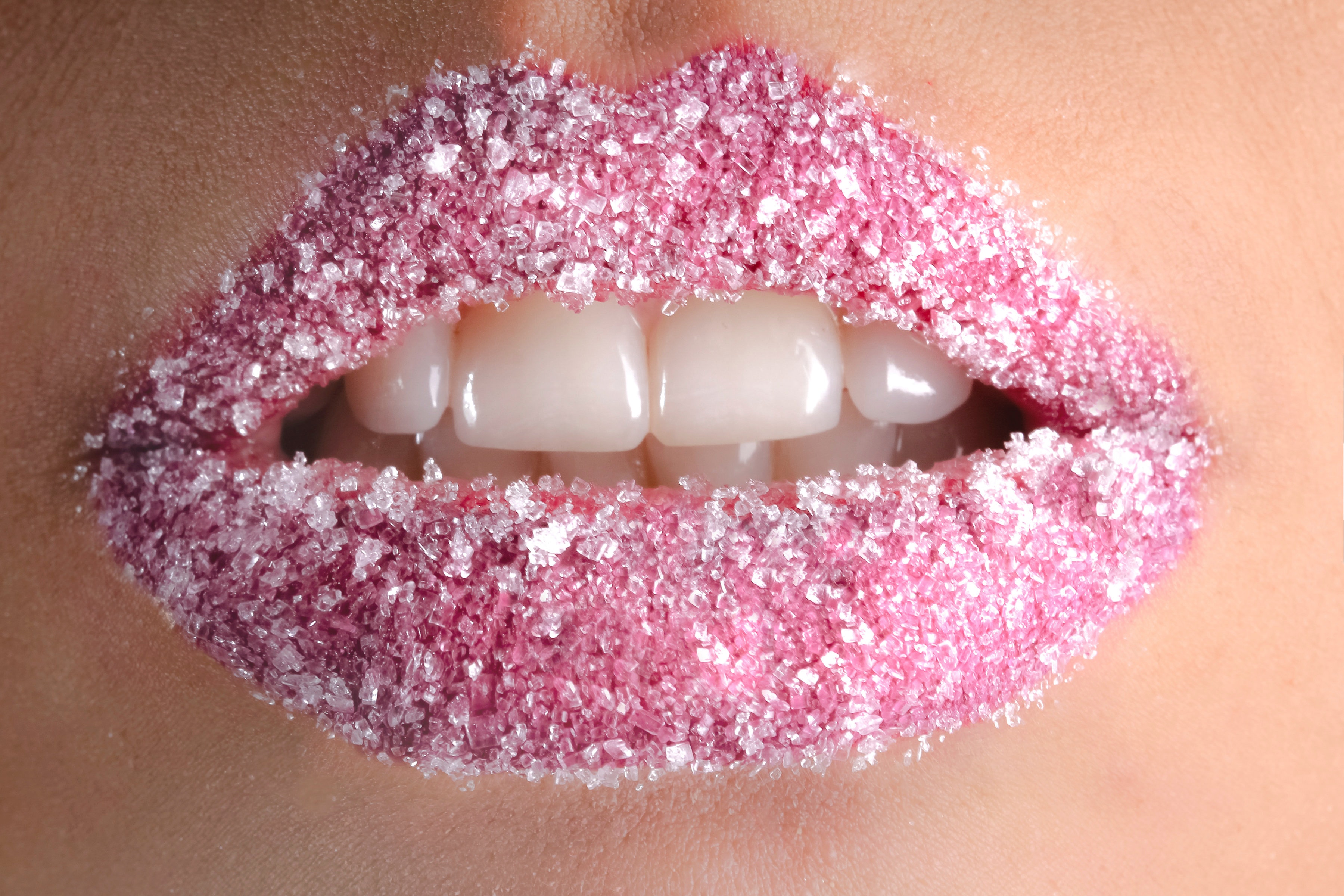 White granules on person lips photo