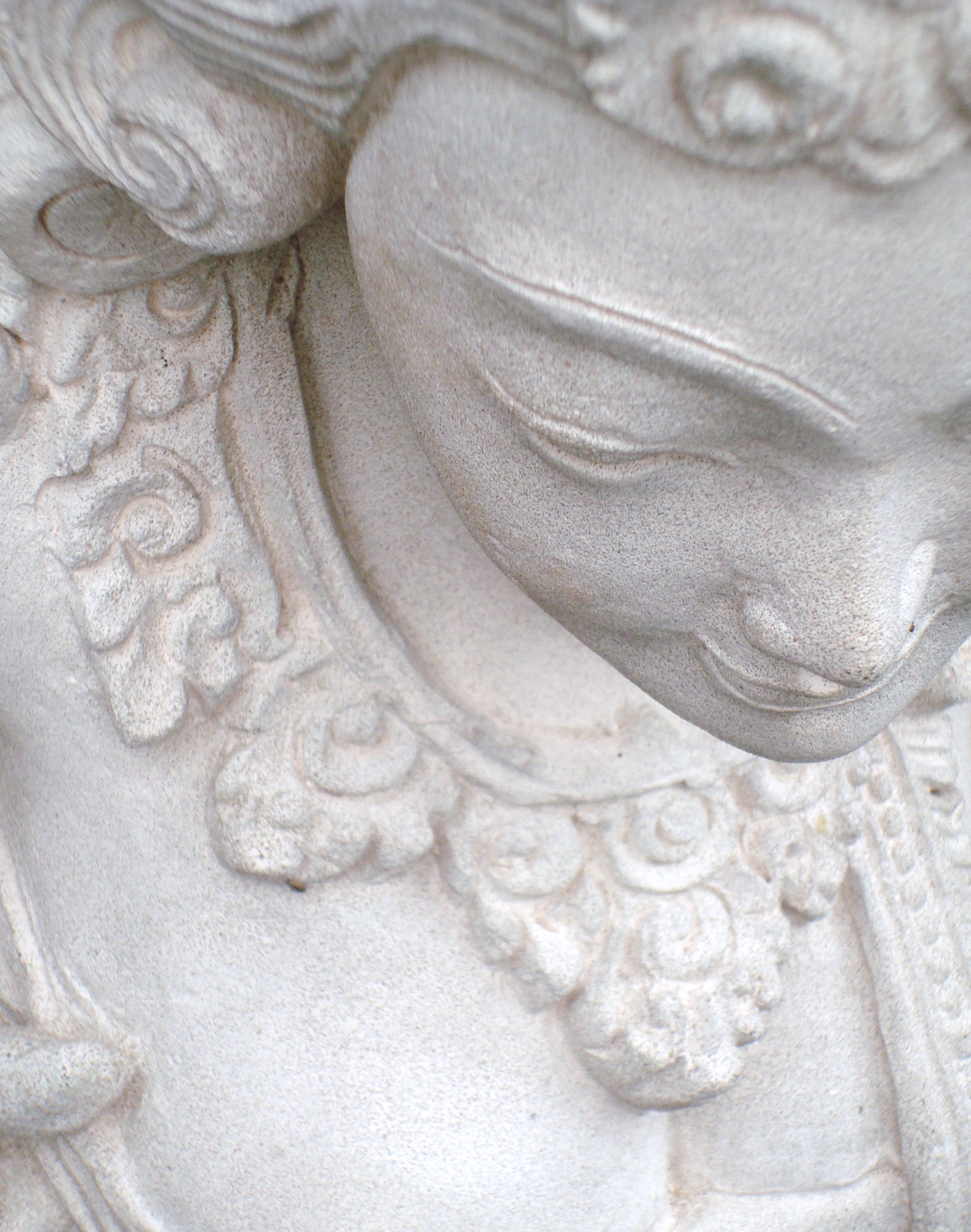 White oriental stone figurine photo