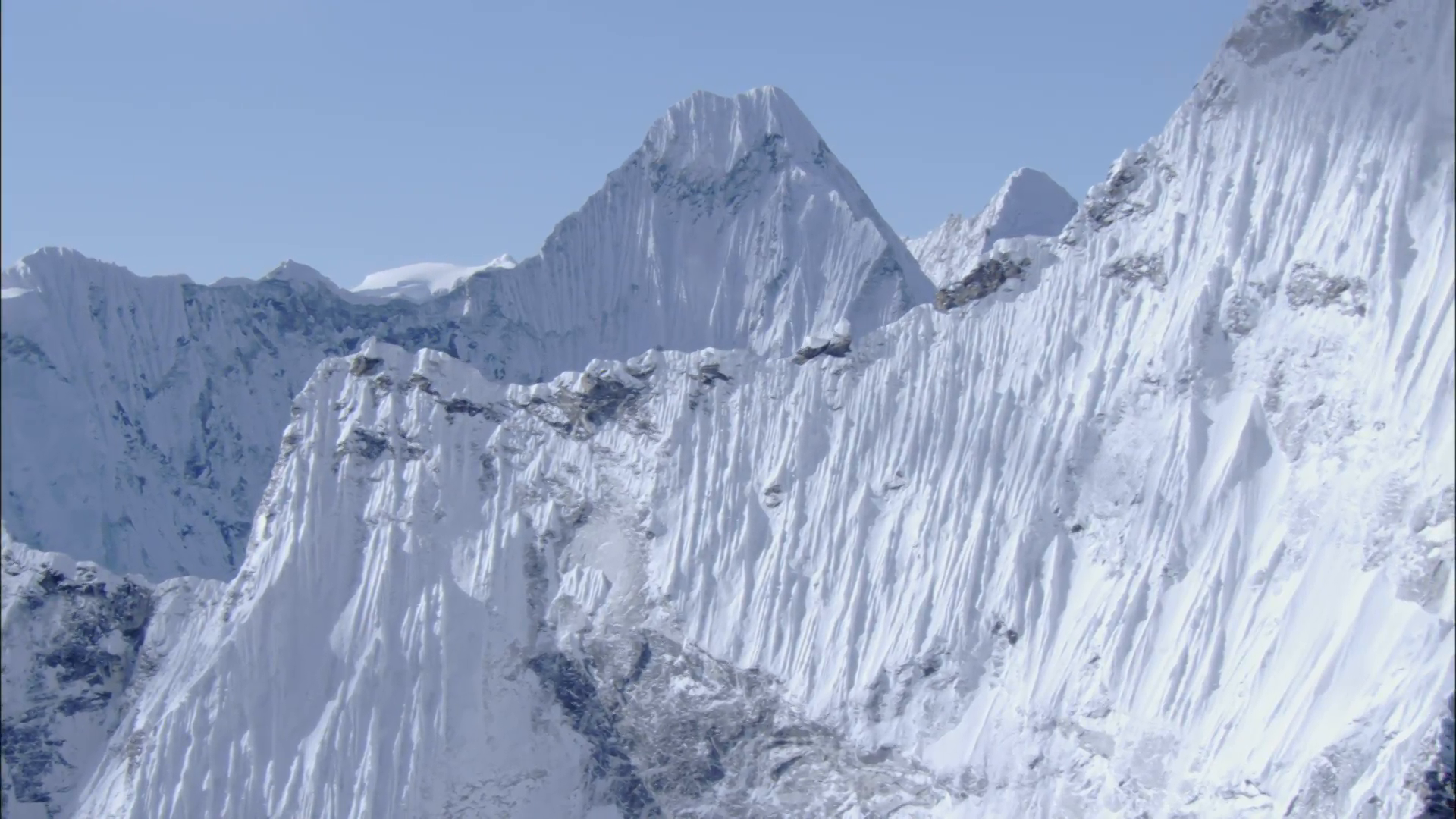 White Snow Himalaya Mountains. Steep mountain ridges covered in ...