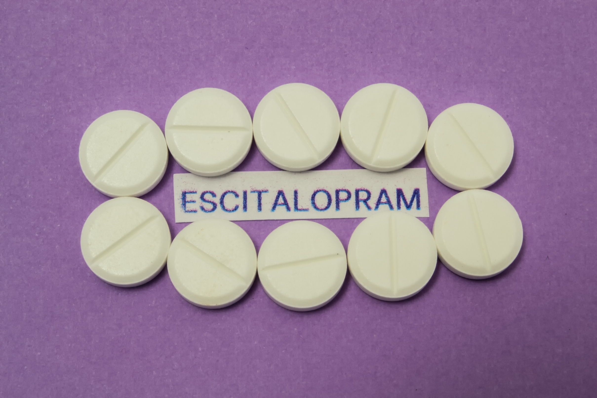 White tablet with generic name escitalopram photo