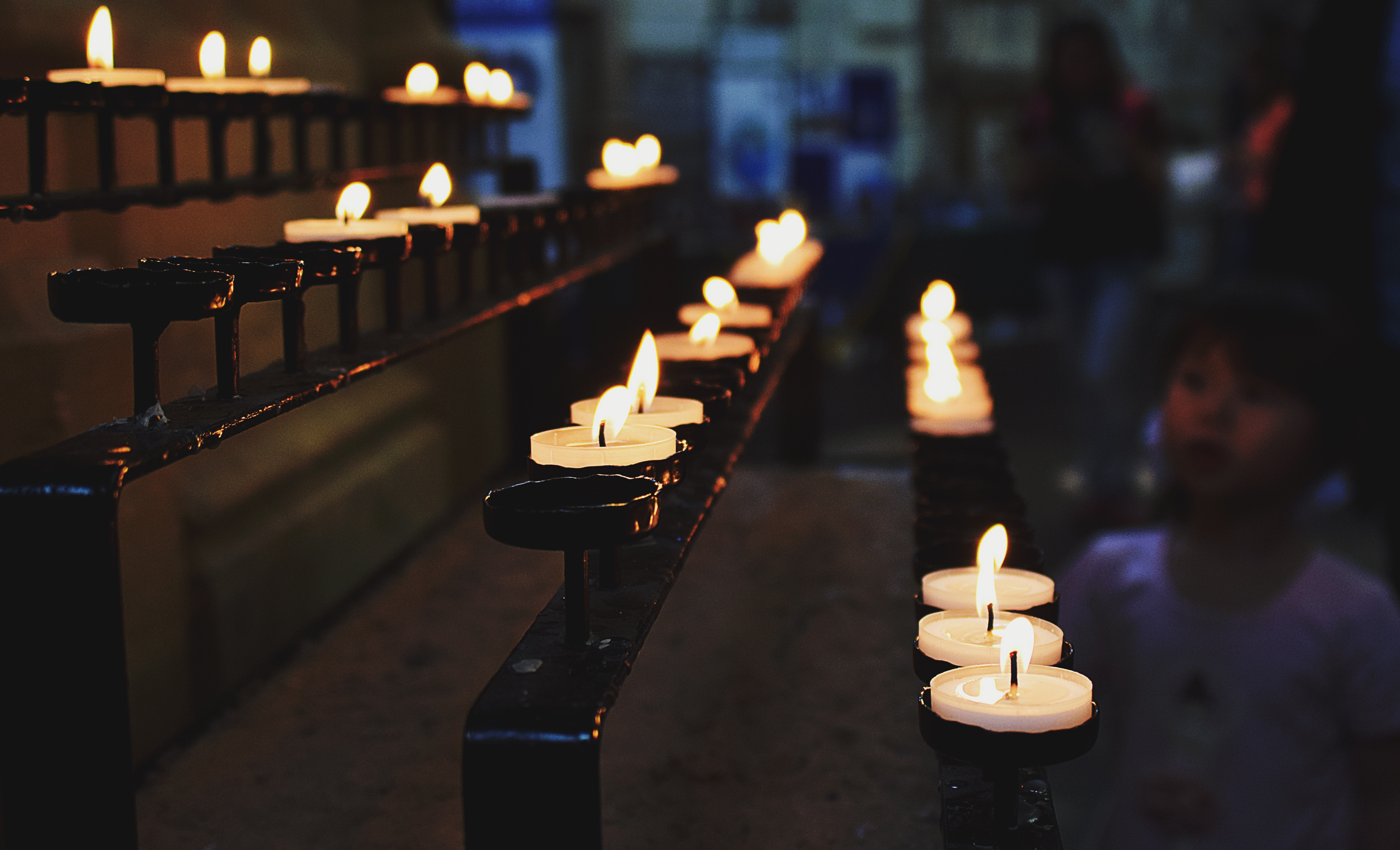 White tealight candles lit during nighttime photo