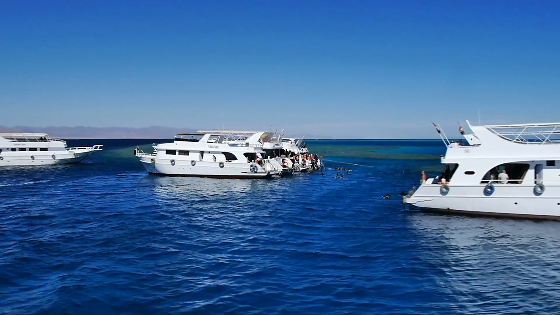 Luxury yachts in the Red Sea in Egypt. White yachts drifting in ...