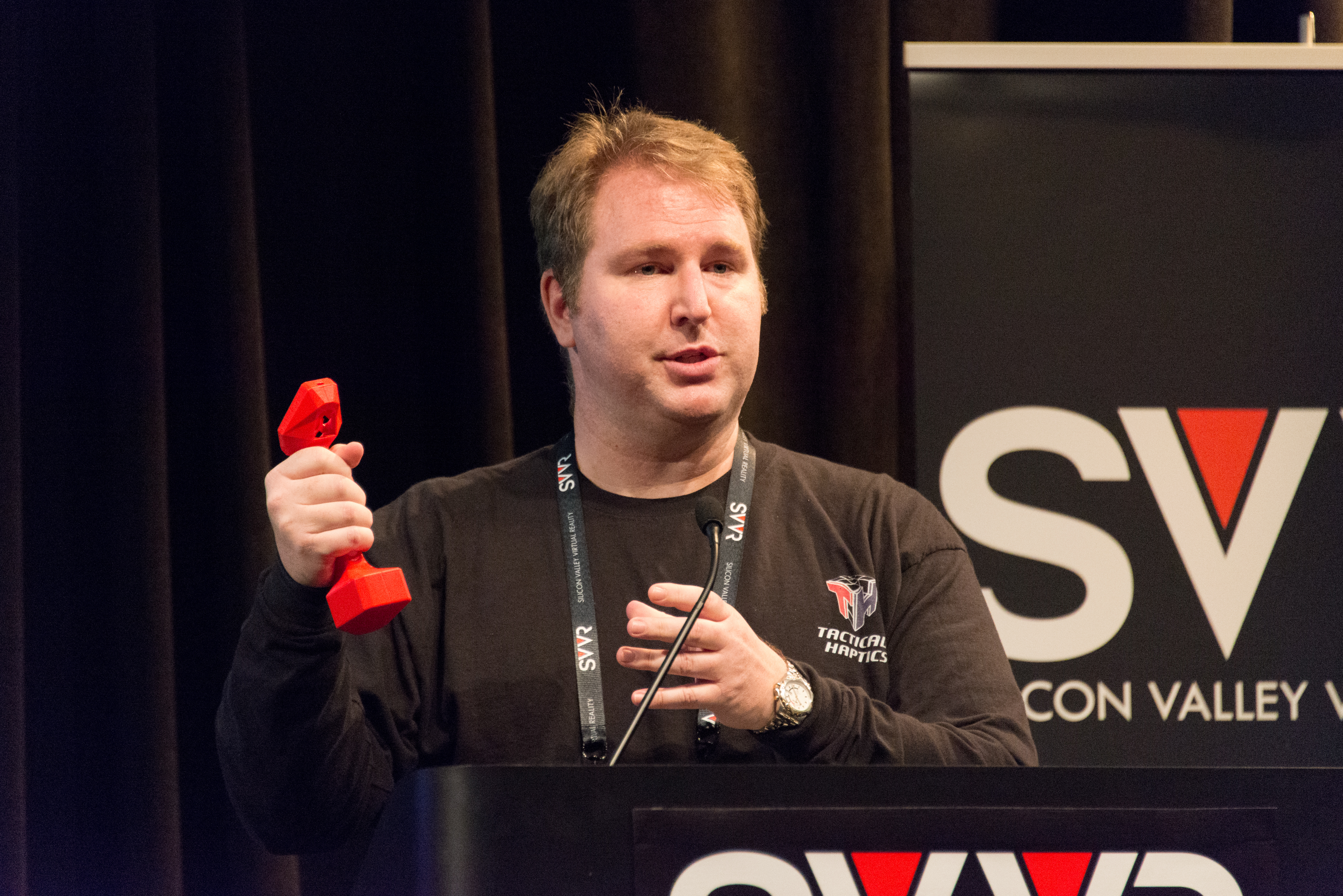 William provancher (founder/ceo of tactical haptics) giving 60 second pitch at svvr and showing reactive grip photo