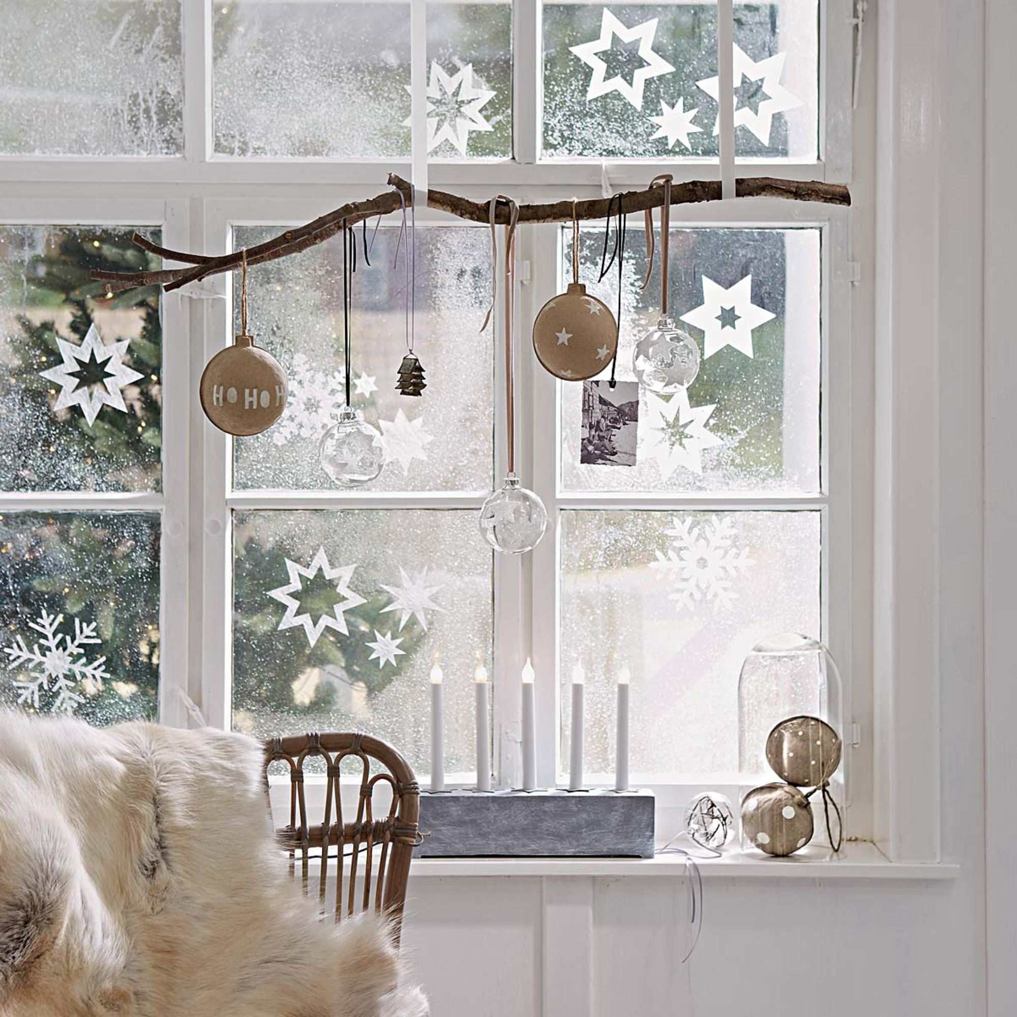 hang a branch in the window with wide ribbon and hang ornaments ...