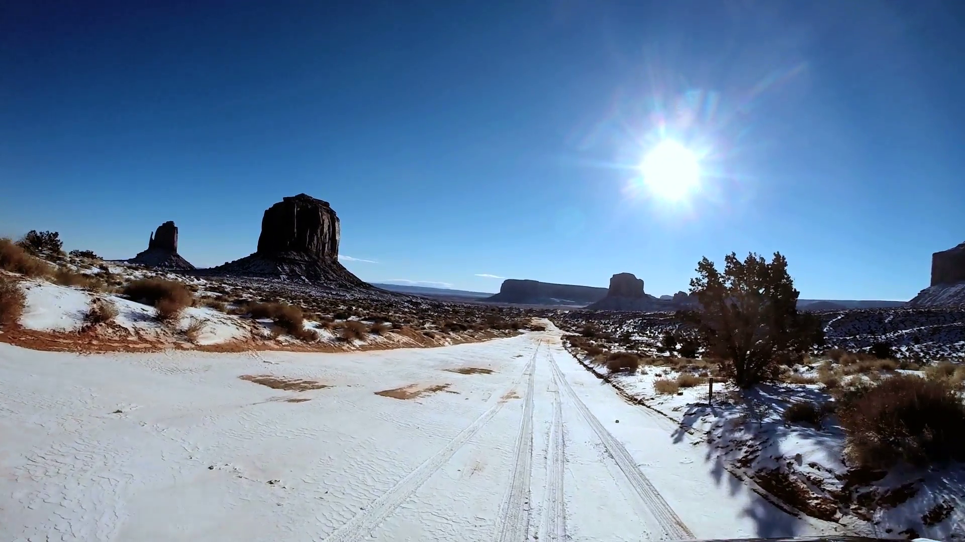 POV road driving desert winter snow Colorado Plateau Monument Valley ...