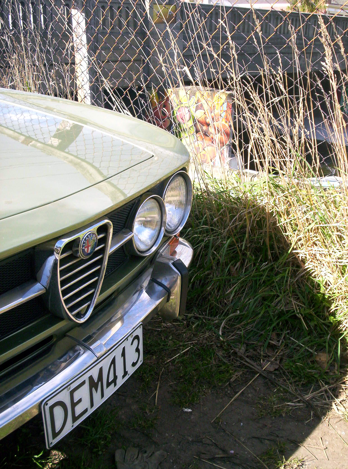 Wire fence and car photo