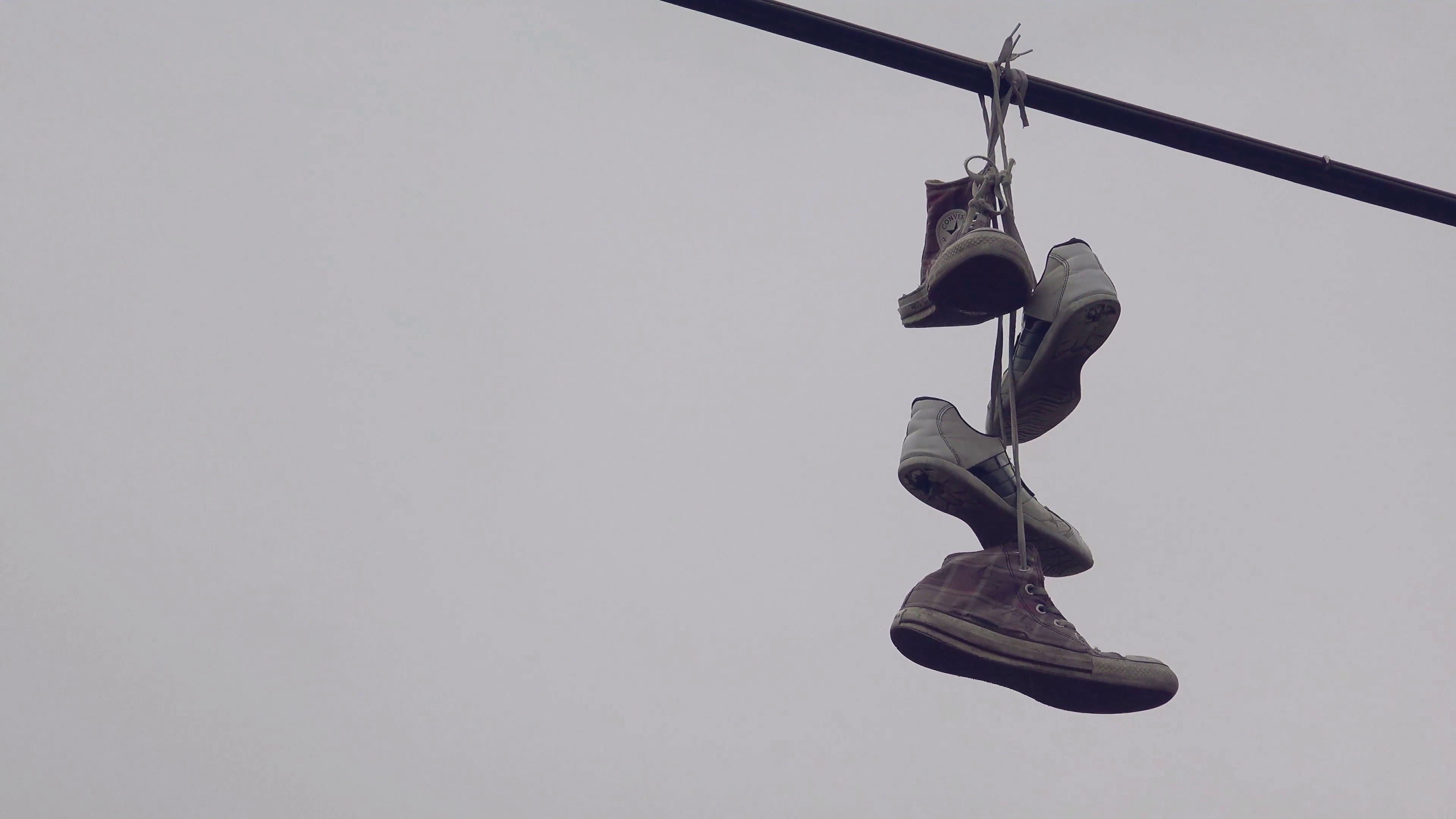 Shoe Tossing, Old Sneakers Hanging on Power Line Wire, Urban Scenery ...