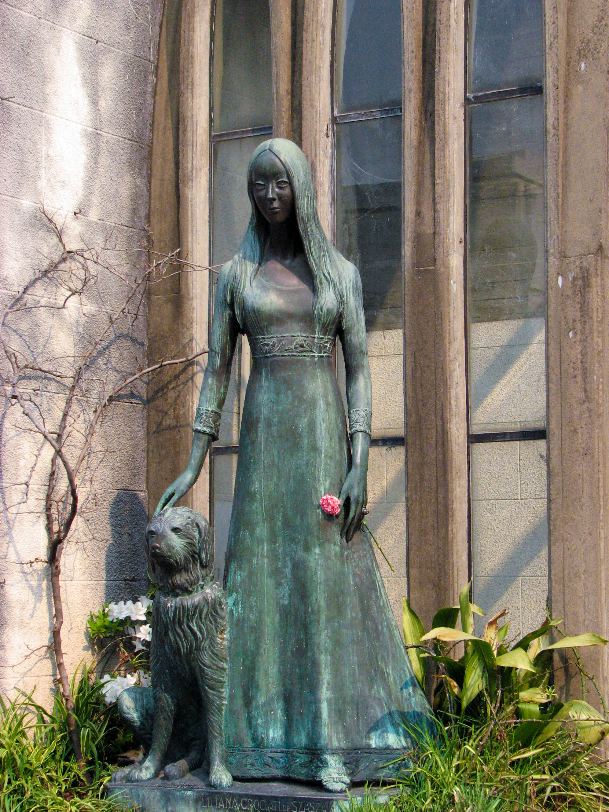 Woman and dog statue photo
