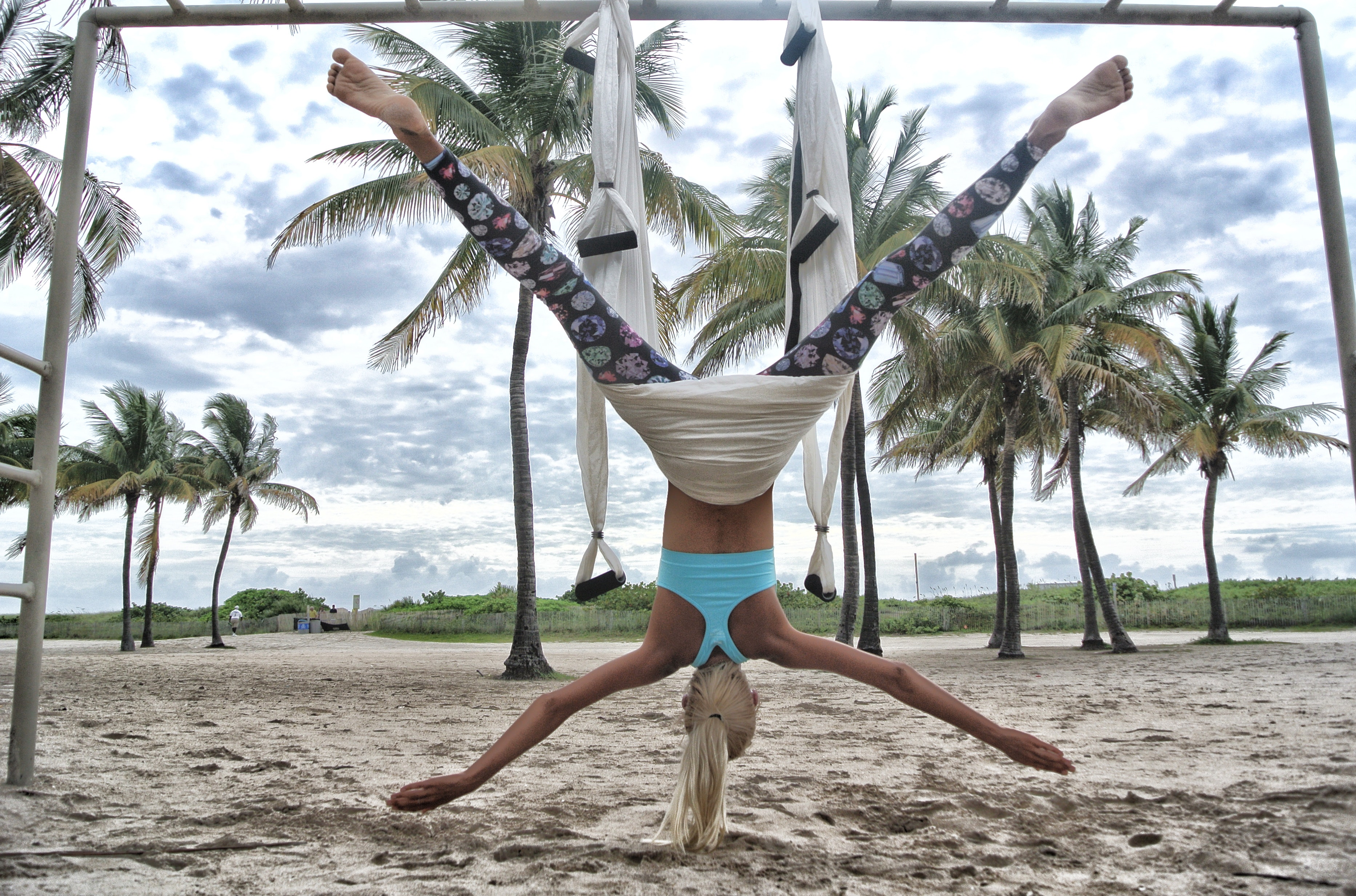Woman doing anti-gravity yoga photo