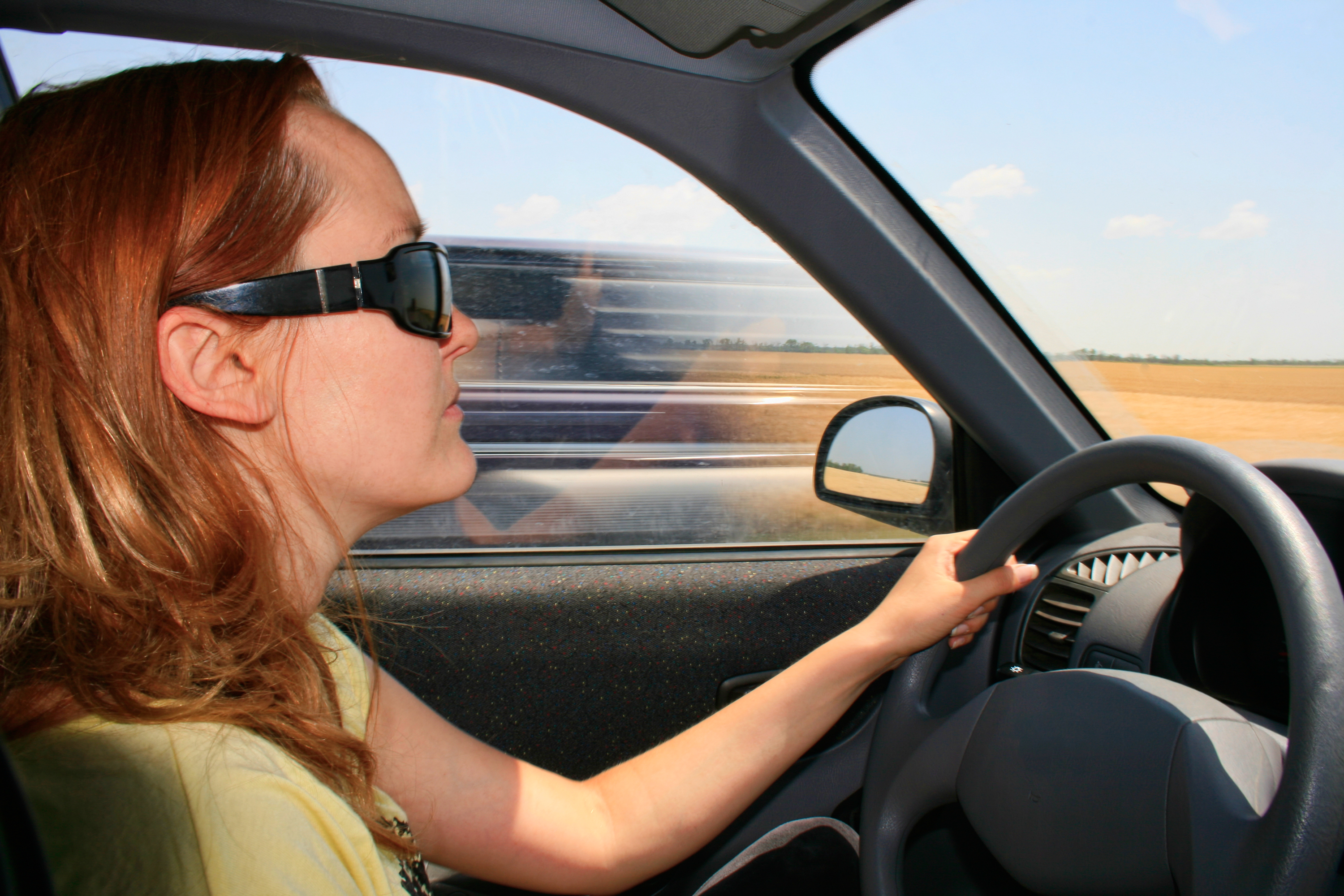 Woman driving a car photo