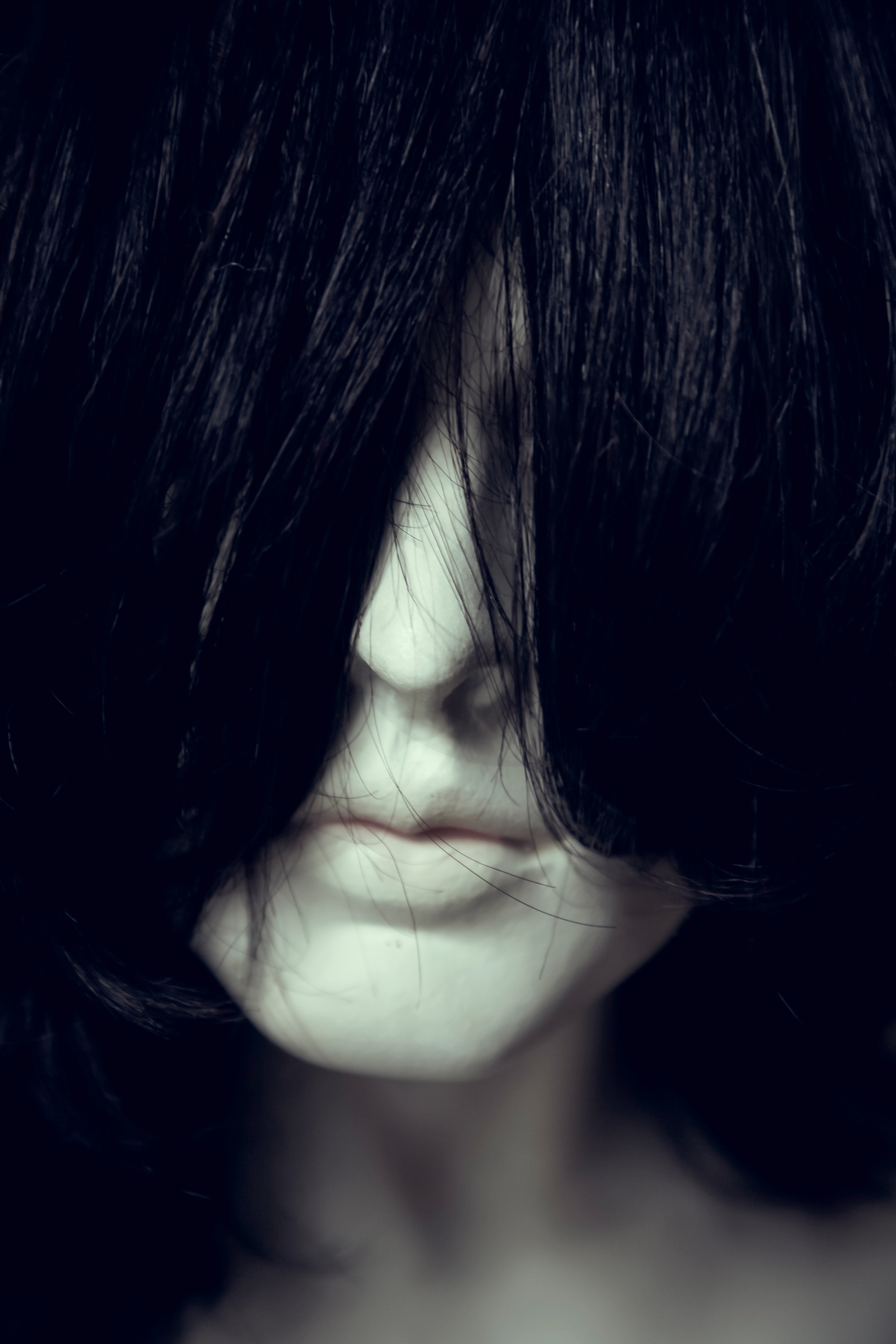 Woman face covered with hair photo