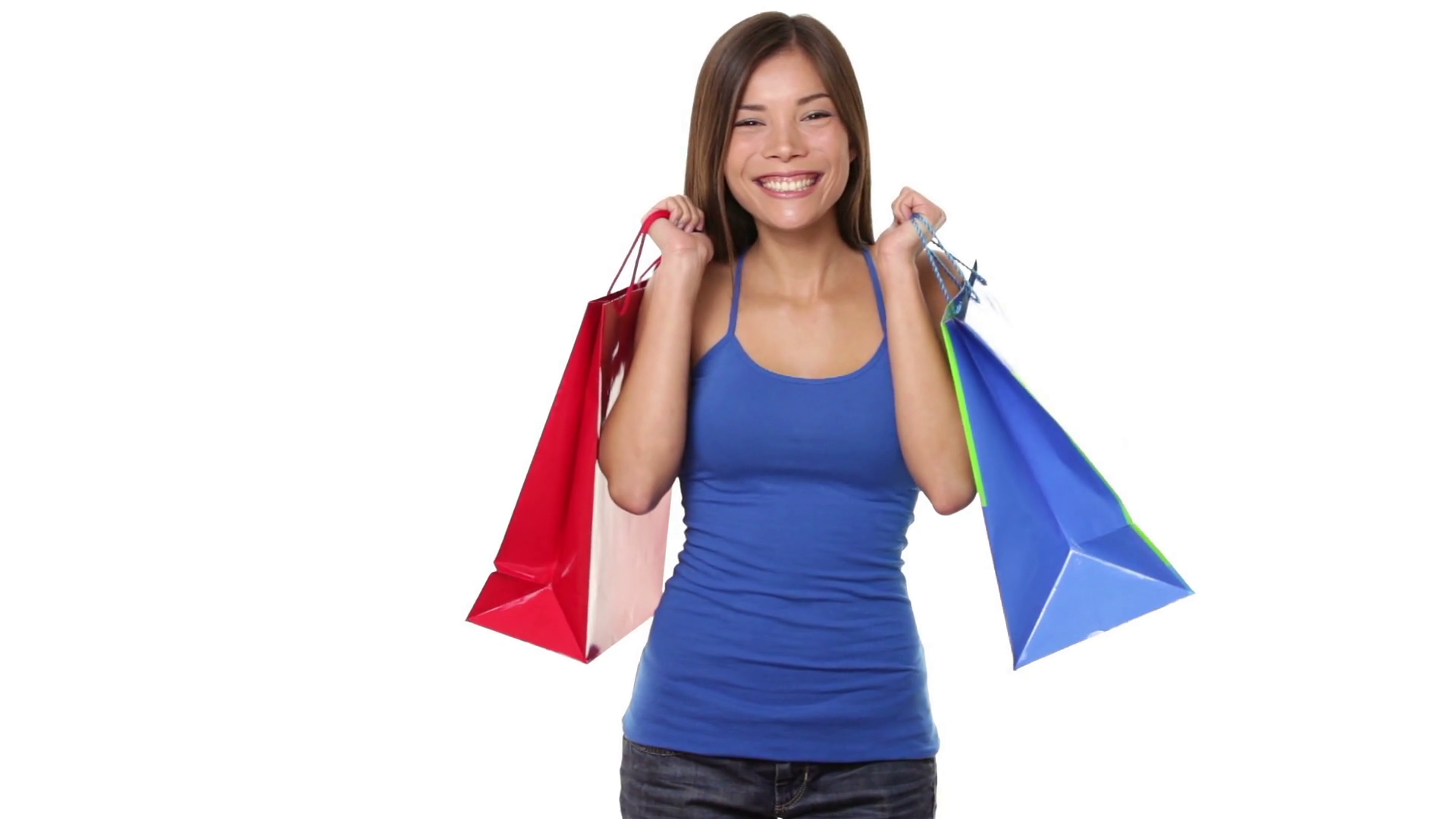 Shopping woman holding shopping bags above her head smiling happy ...