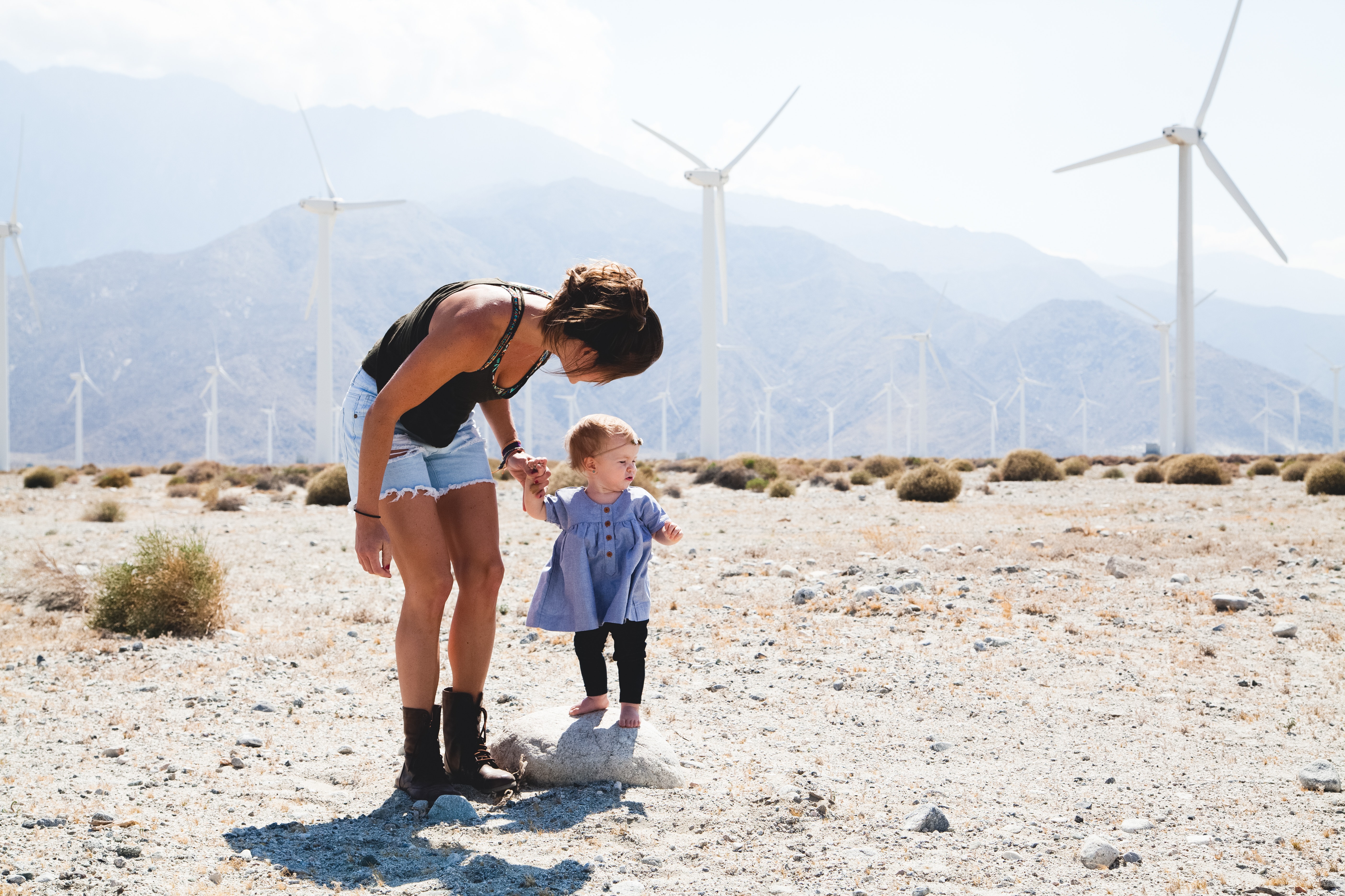 Woman Holding Her Child Walking Near Windmills, Parent, Woman, Windy, Windmills, HQ Photo