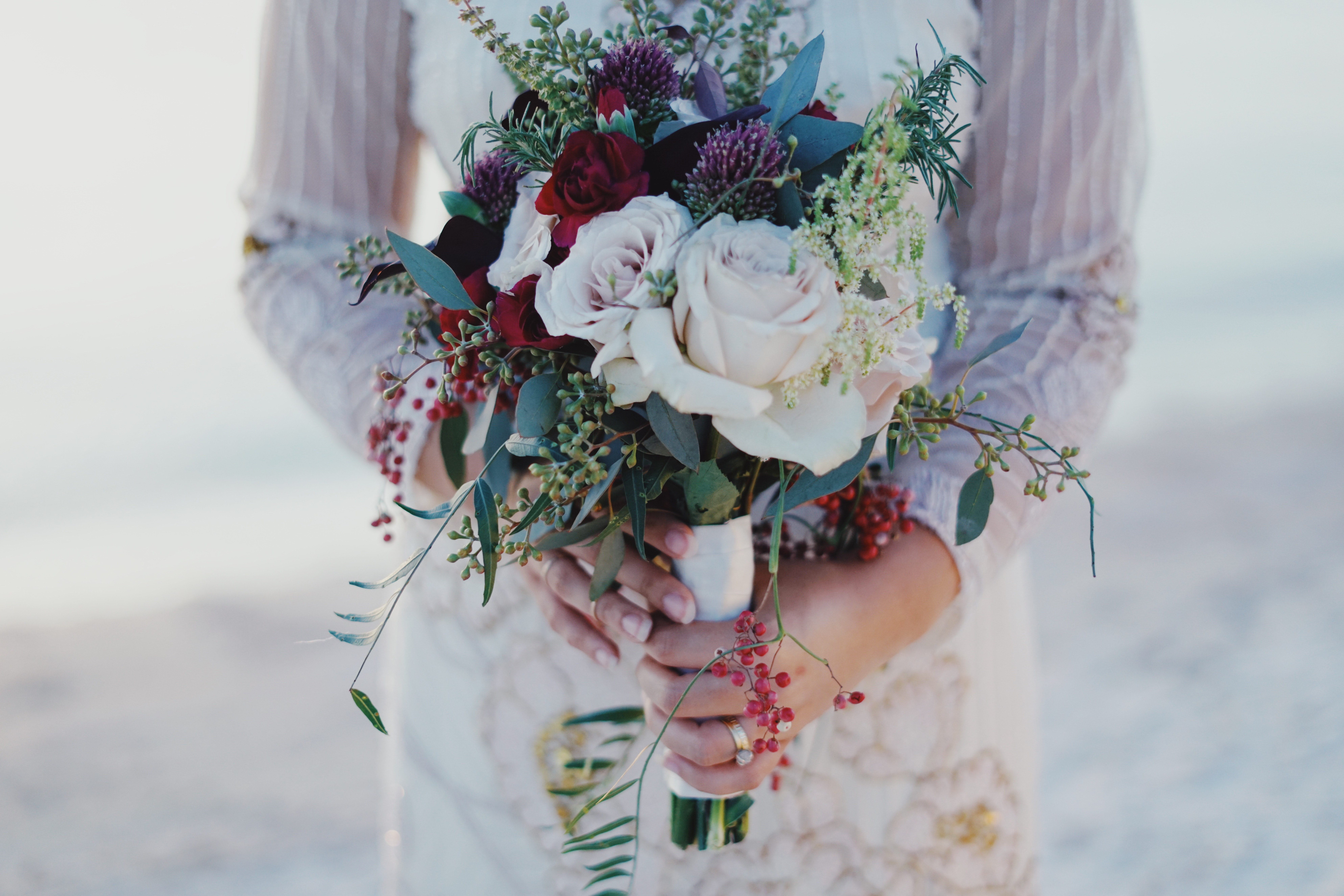 Woman holding red and white rose bouquet photo