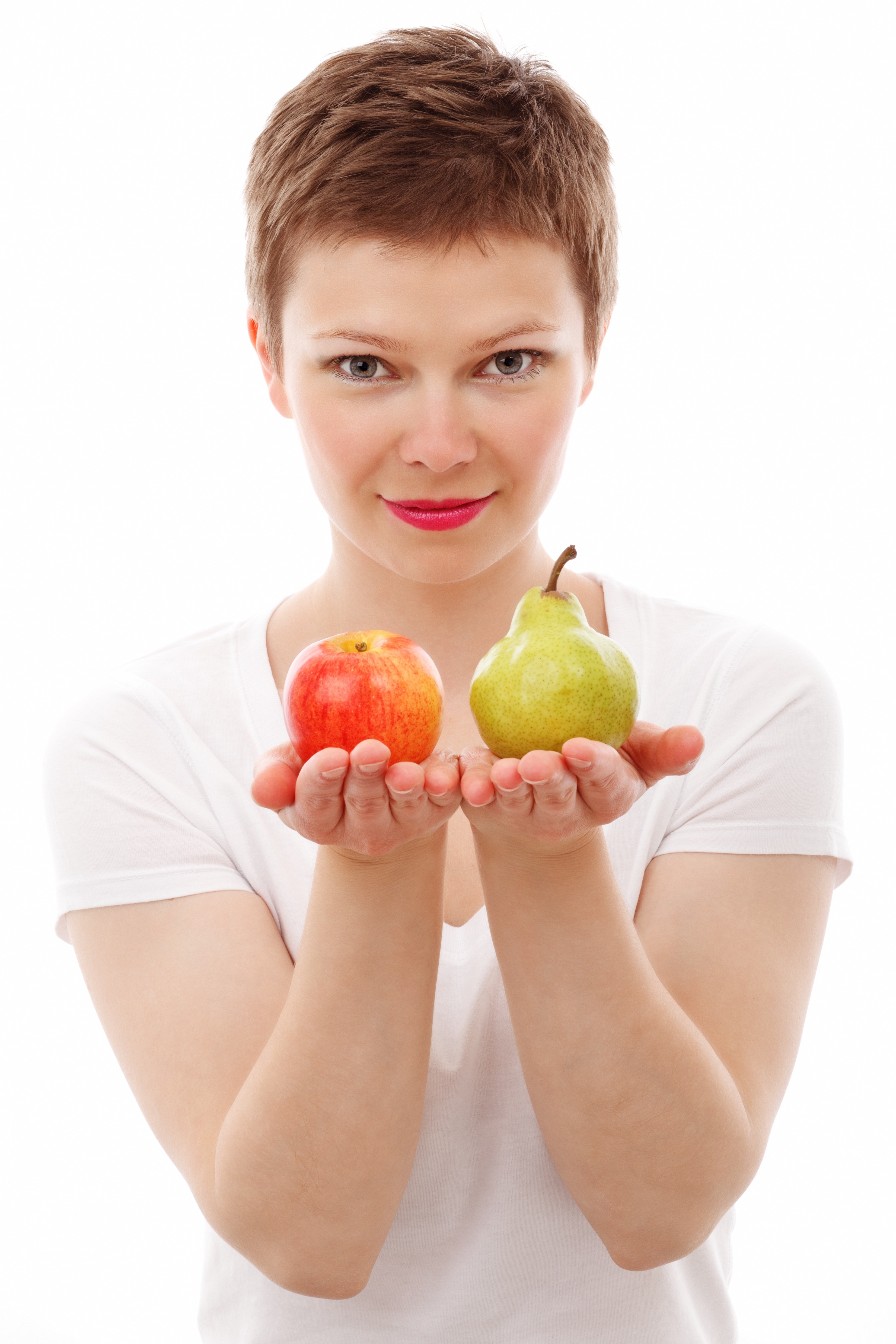 Woman holding red apple and green peach photo