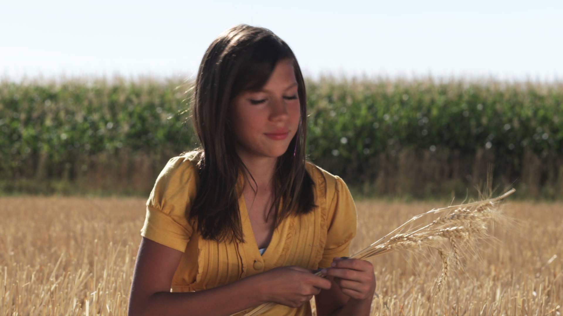 Happy woman in a wheat field holding strands of wheat - YouTube