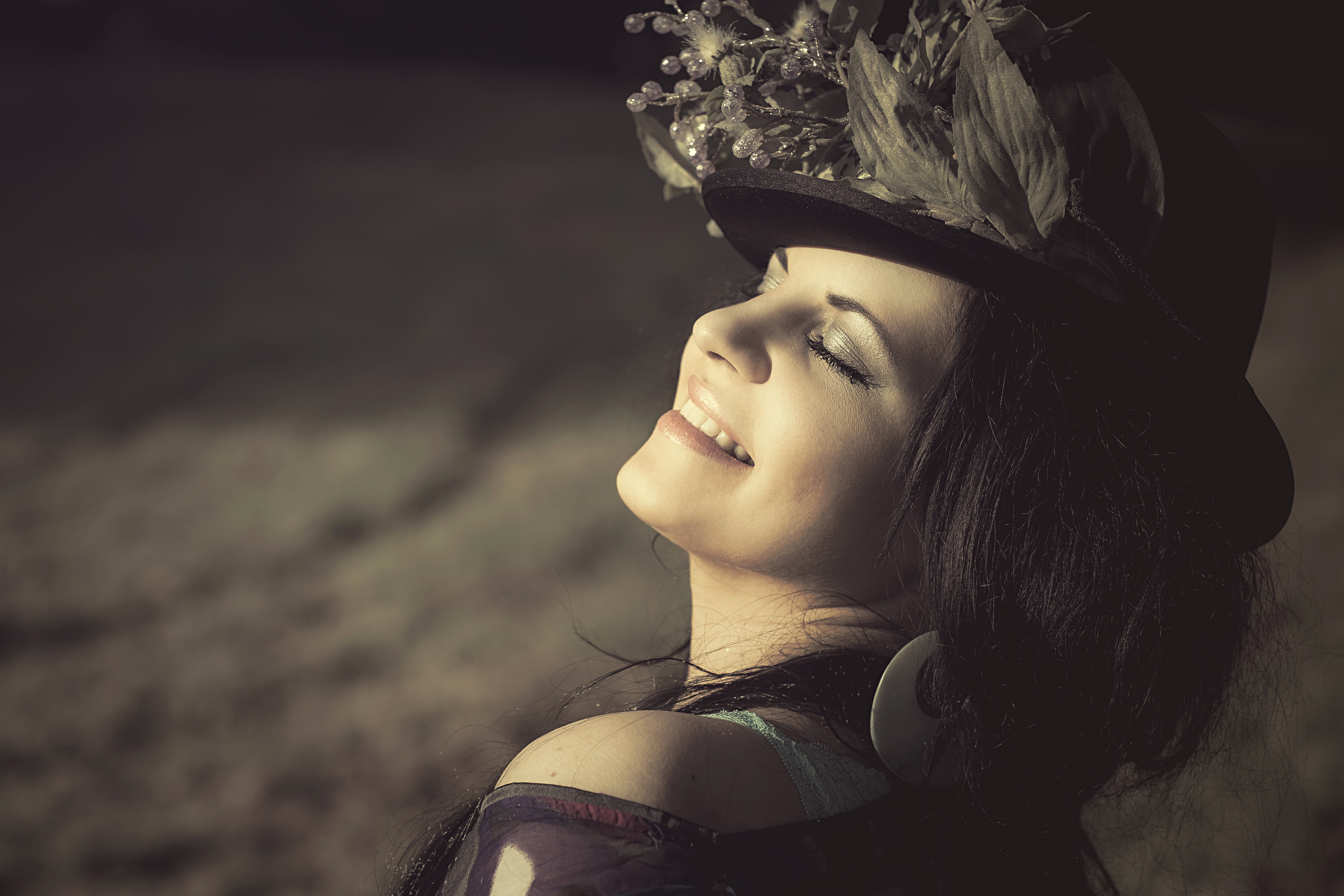 Woman in black hat smiling photo
