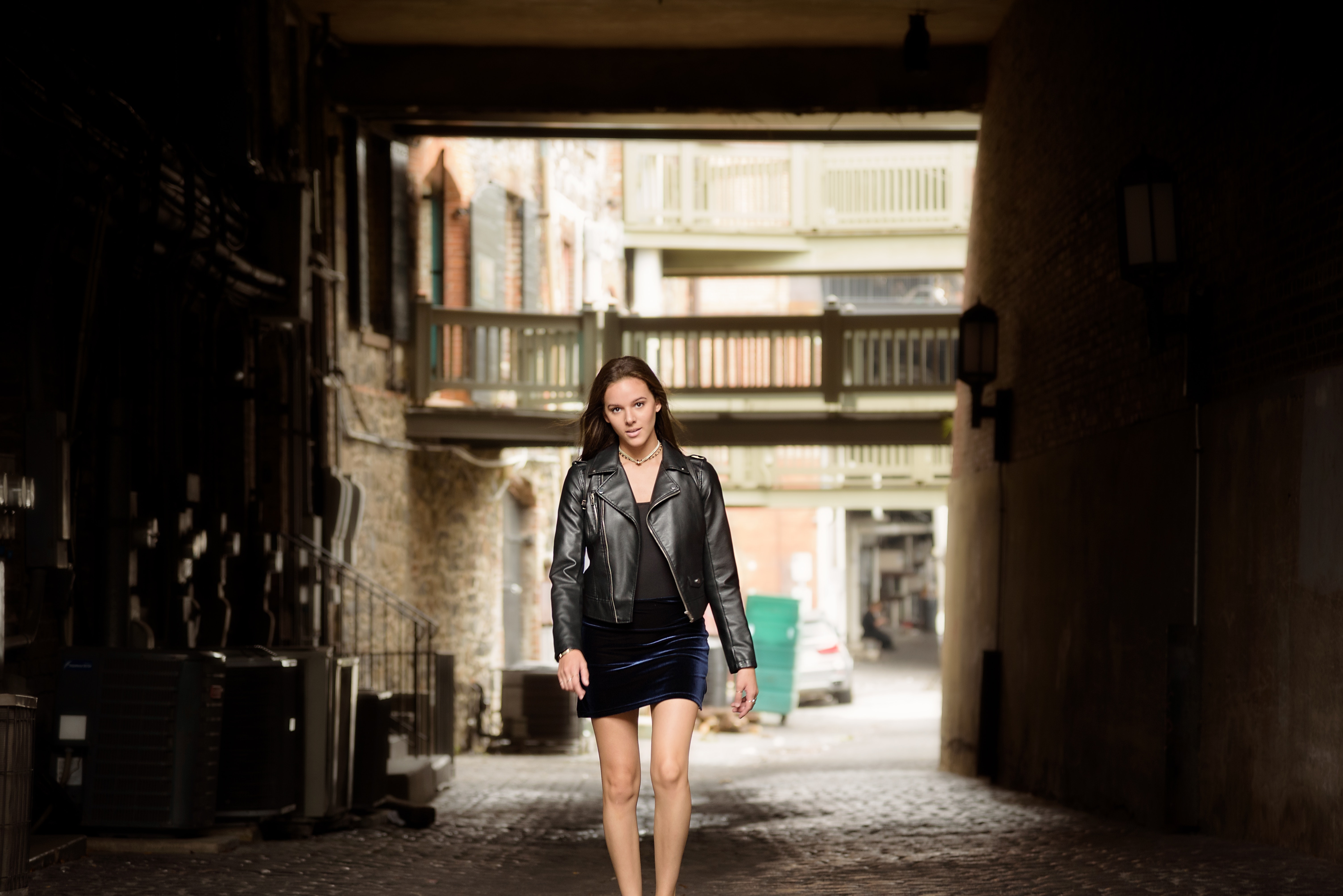 Woman in black leather jacket and skirt photo