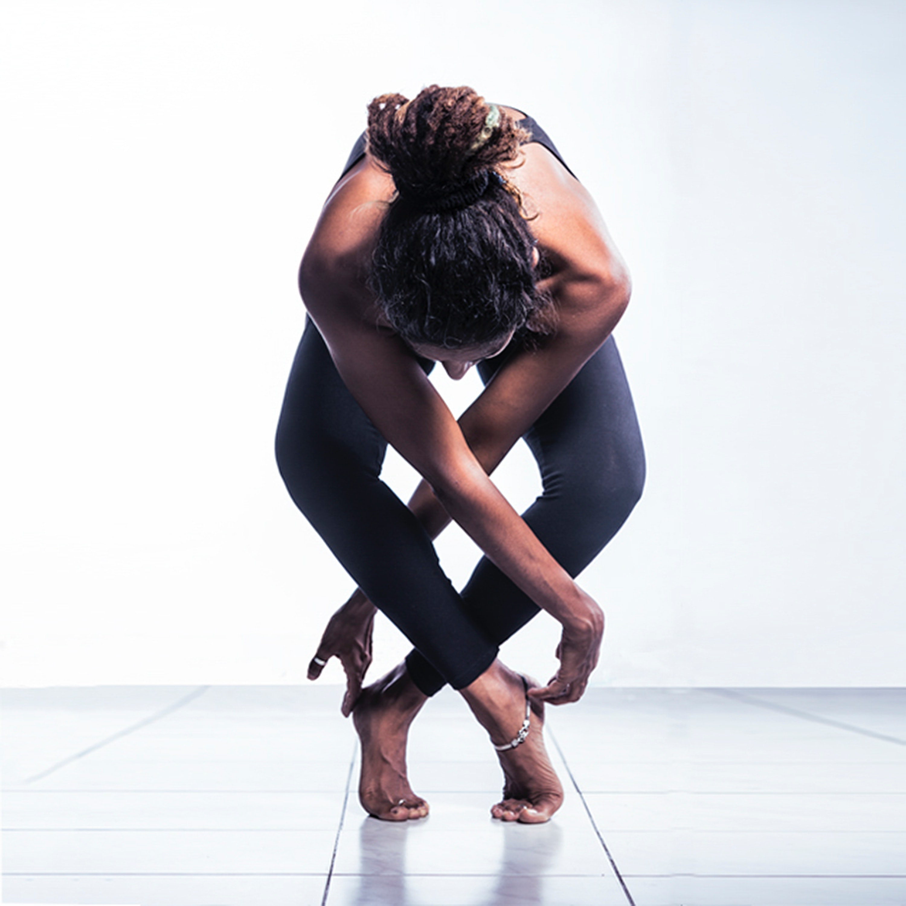 Woman in black pants doing yoga photo