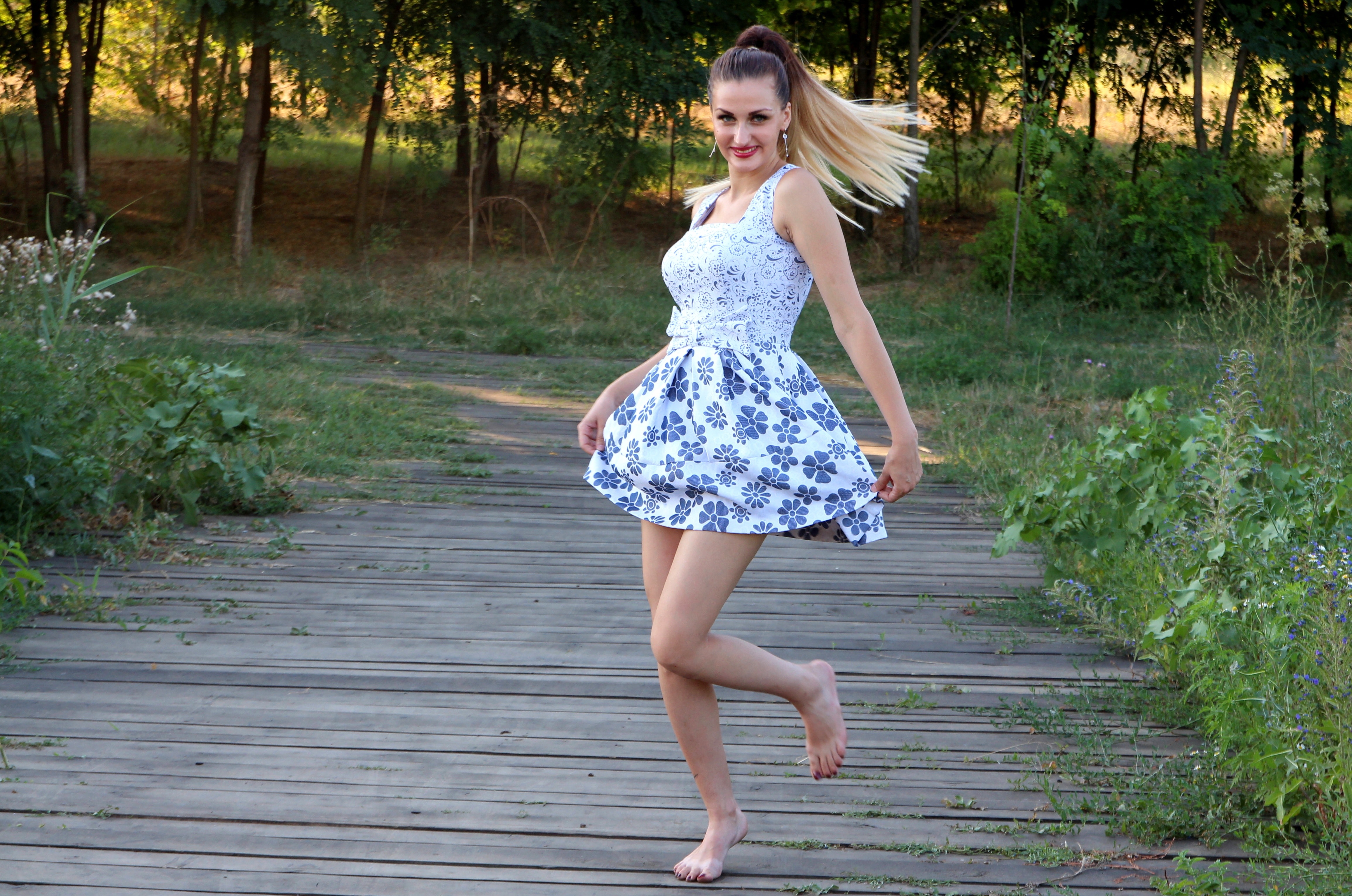 Woman in blue and white skated dress photo