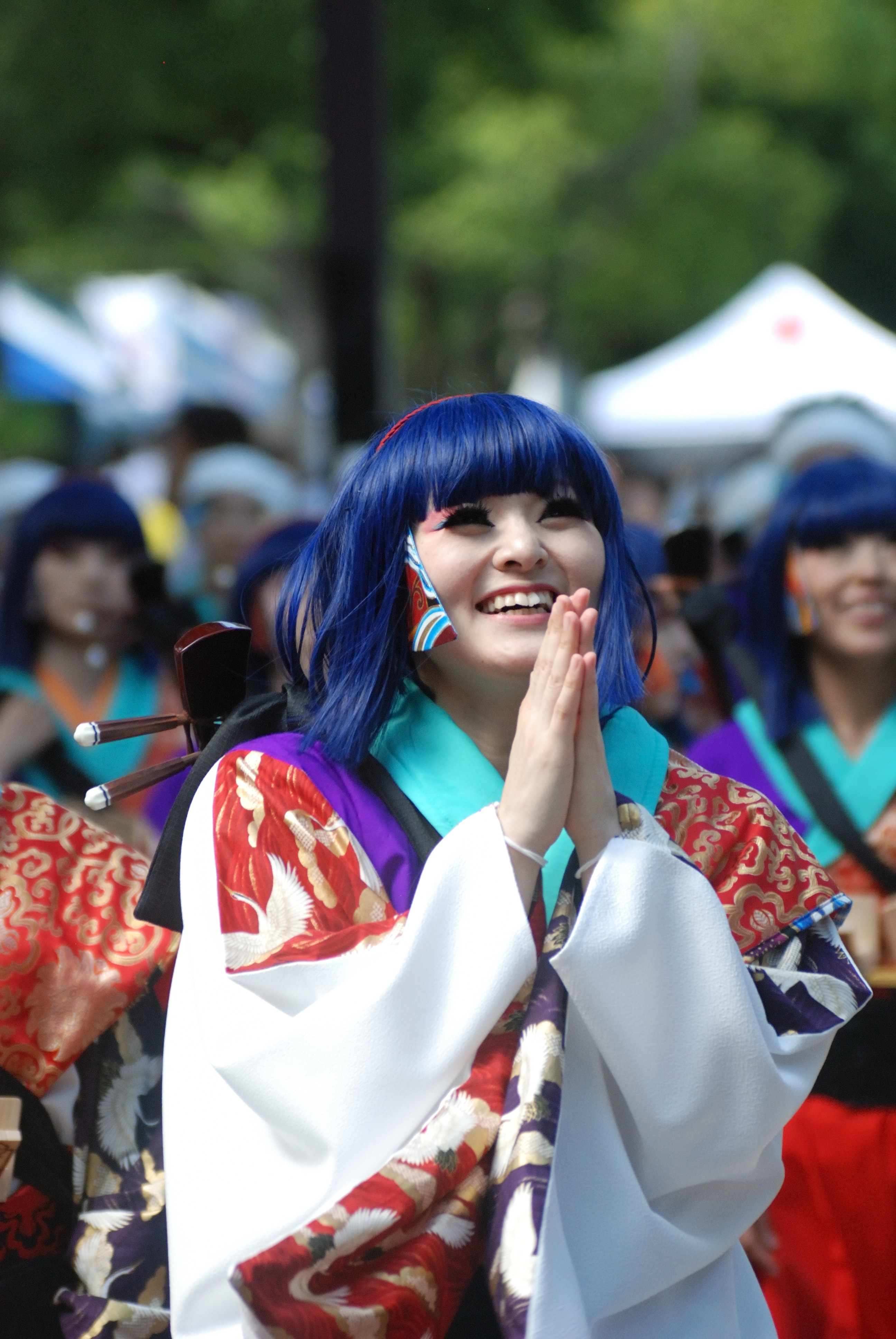 Woman in blue hair wearing costume during daytime photo