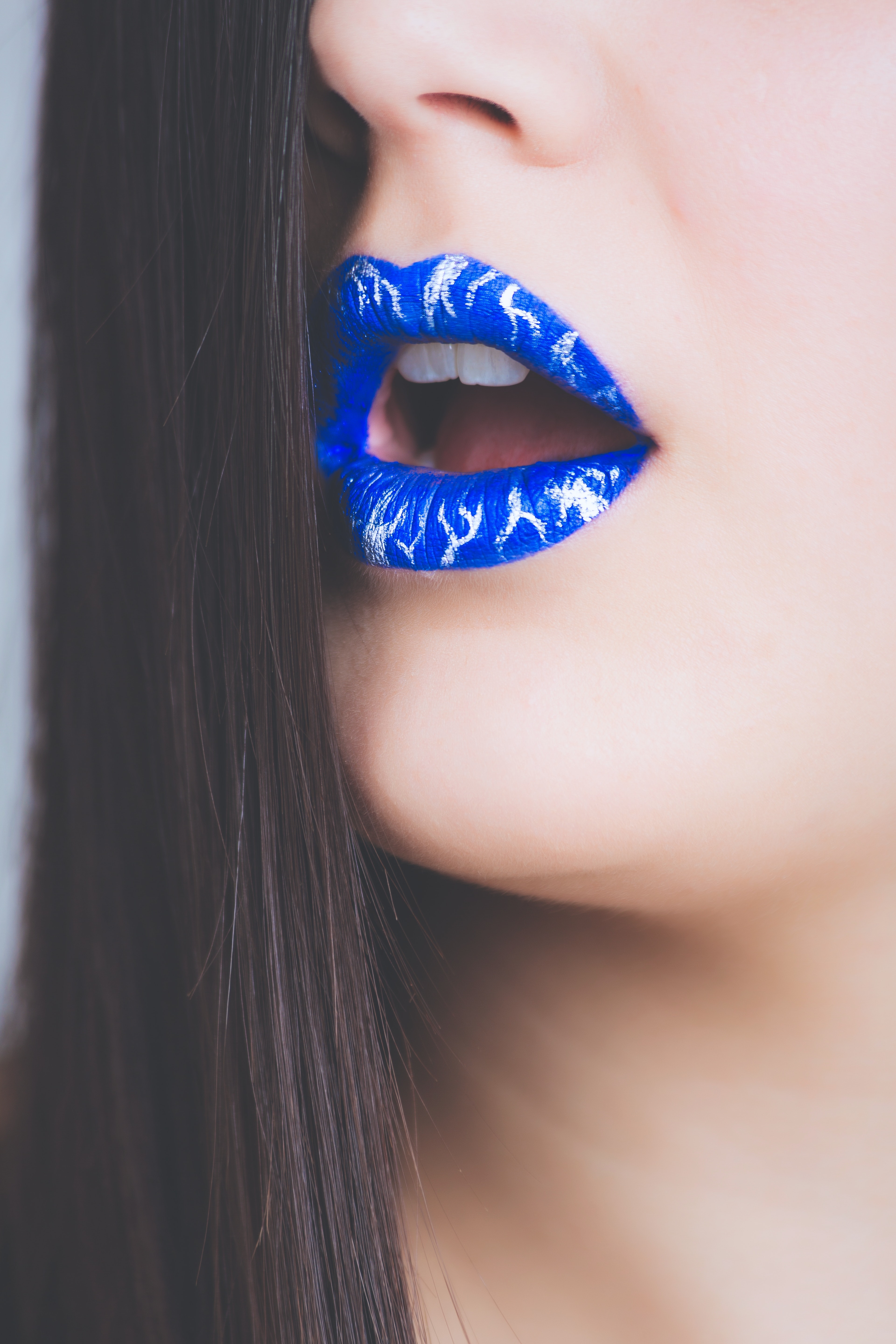 Woman in blue lipstick photo