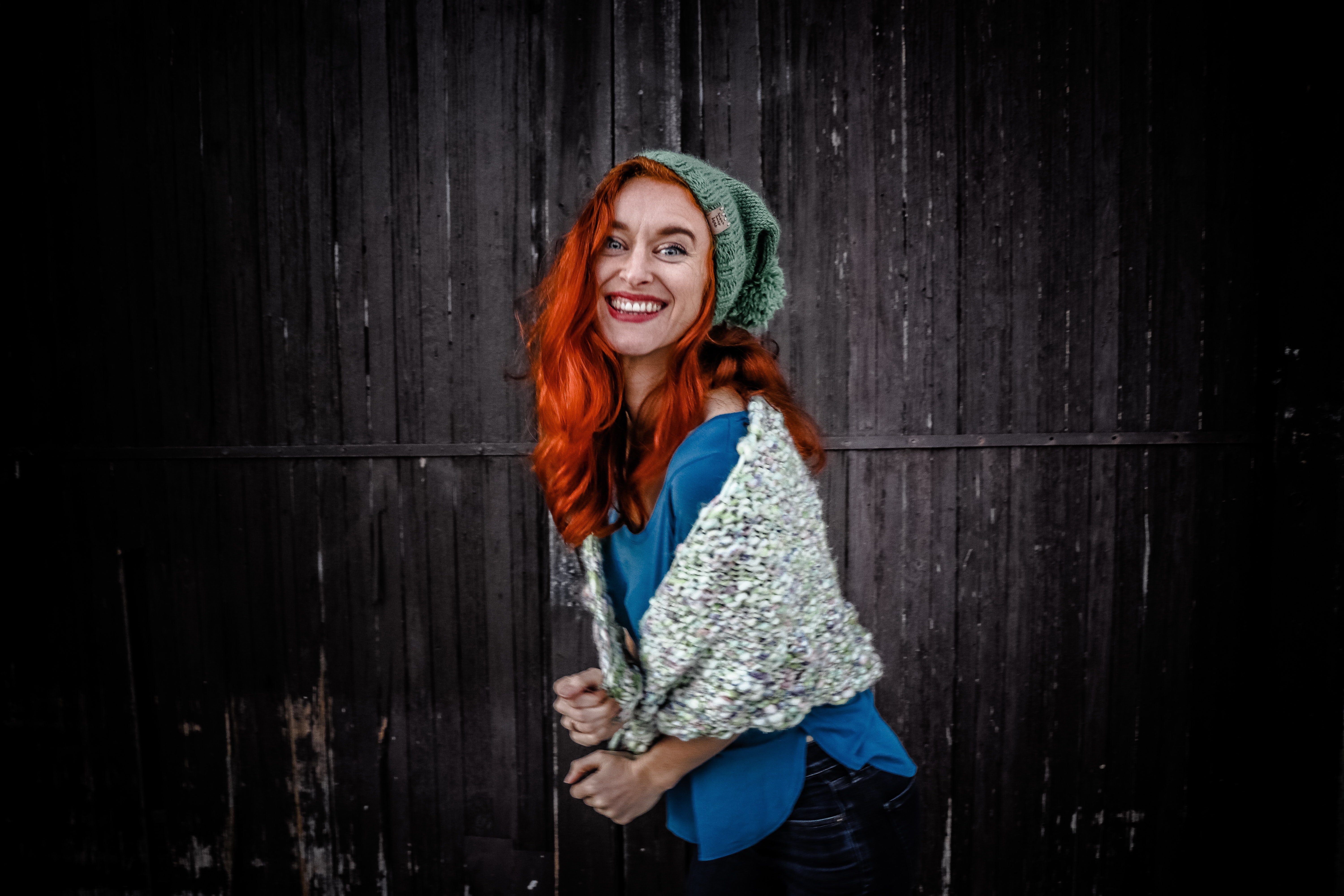 Woman in blue shirt an white scarf with red hair photo