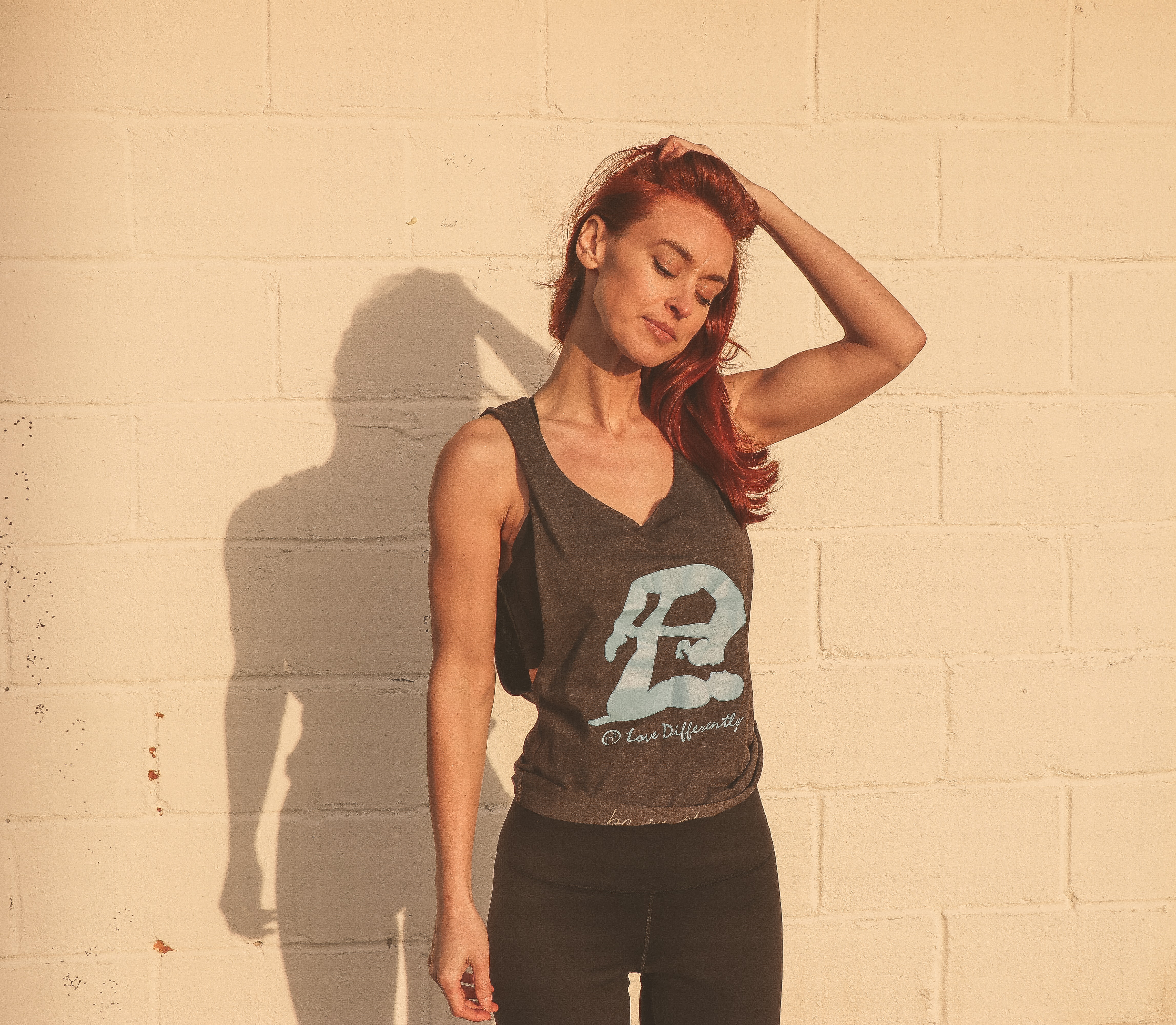 Woman in Gray and Black Tank Top Standing Near Wall, Red head, Outdoors, Pants, Person, HQ Photo
