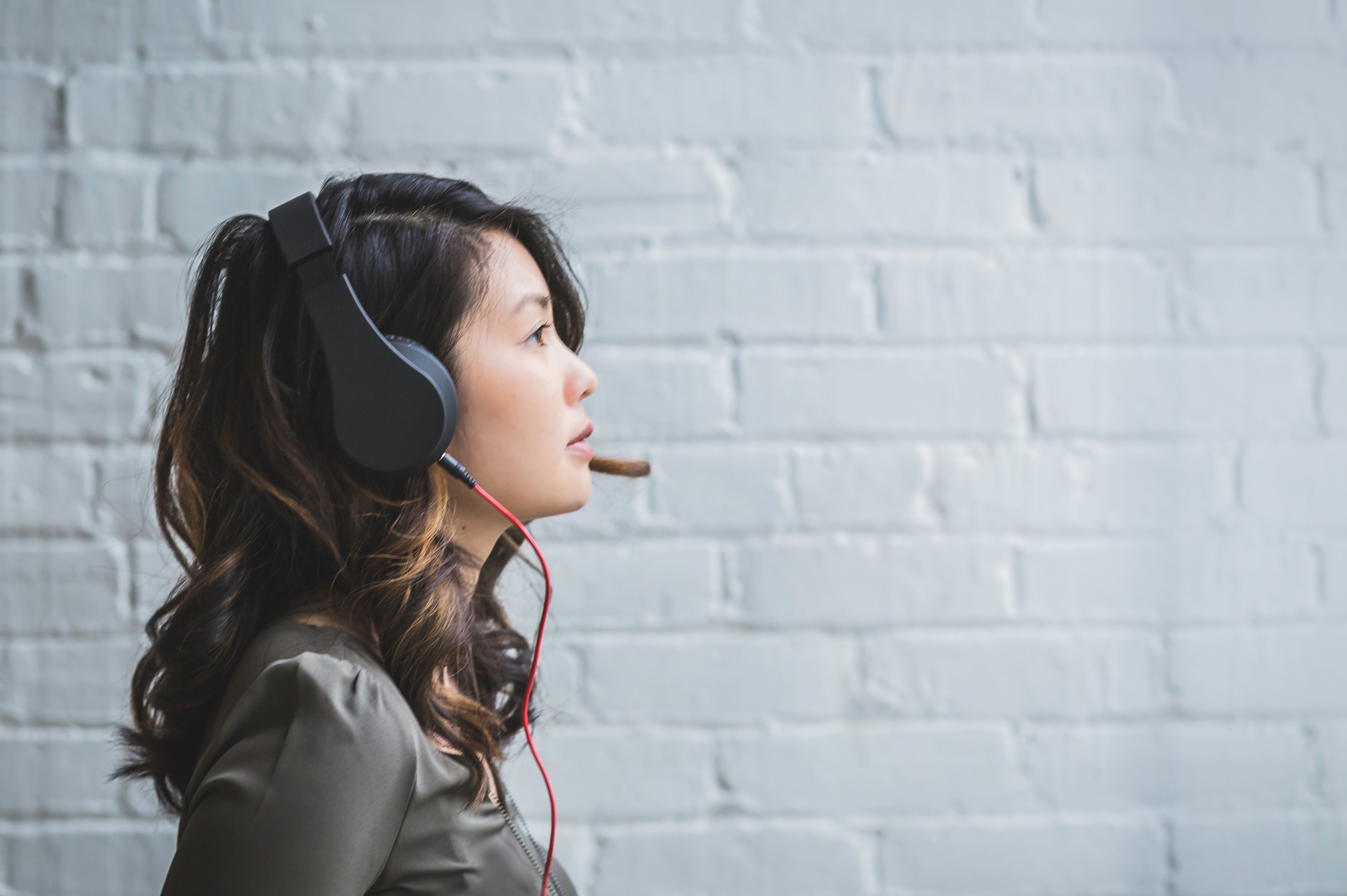 Woman with headphones listening music · Free Stock Photo