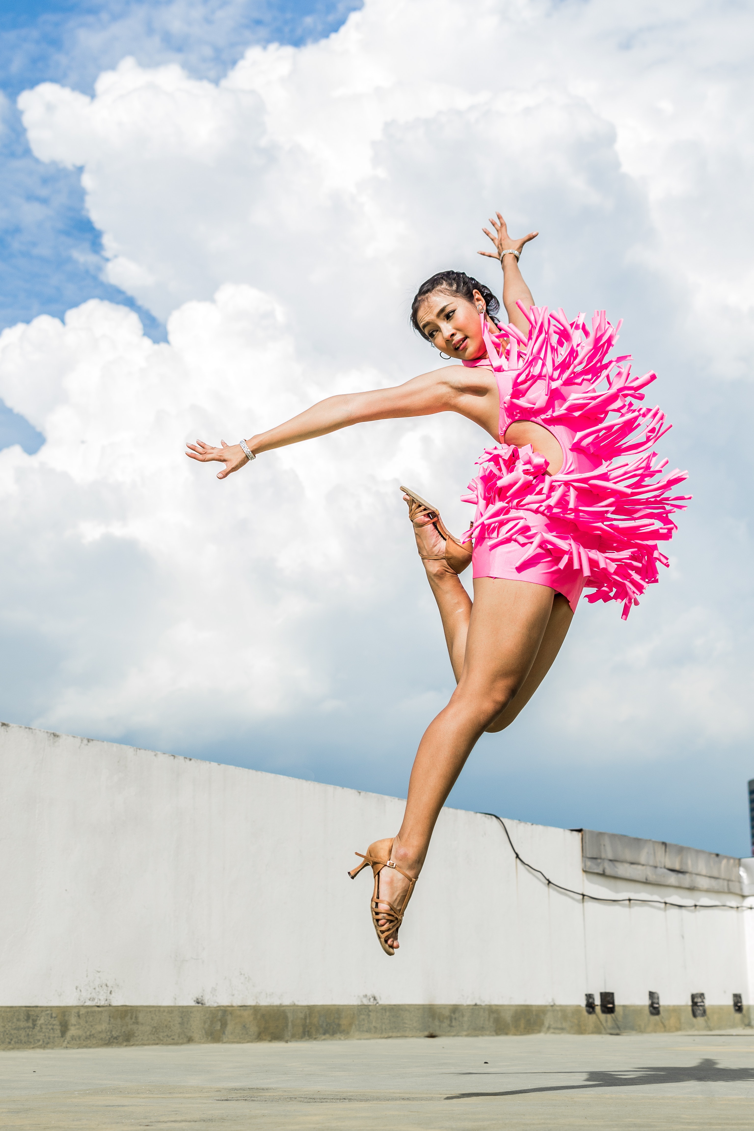 Woman in Pink Dress Doing Jump Shot While Extending Arms Under White Clouds, Active, Joy, Wear, Summer, HQ Photo