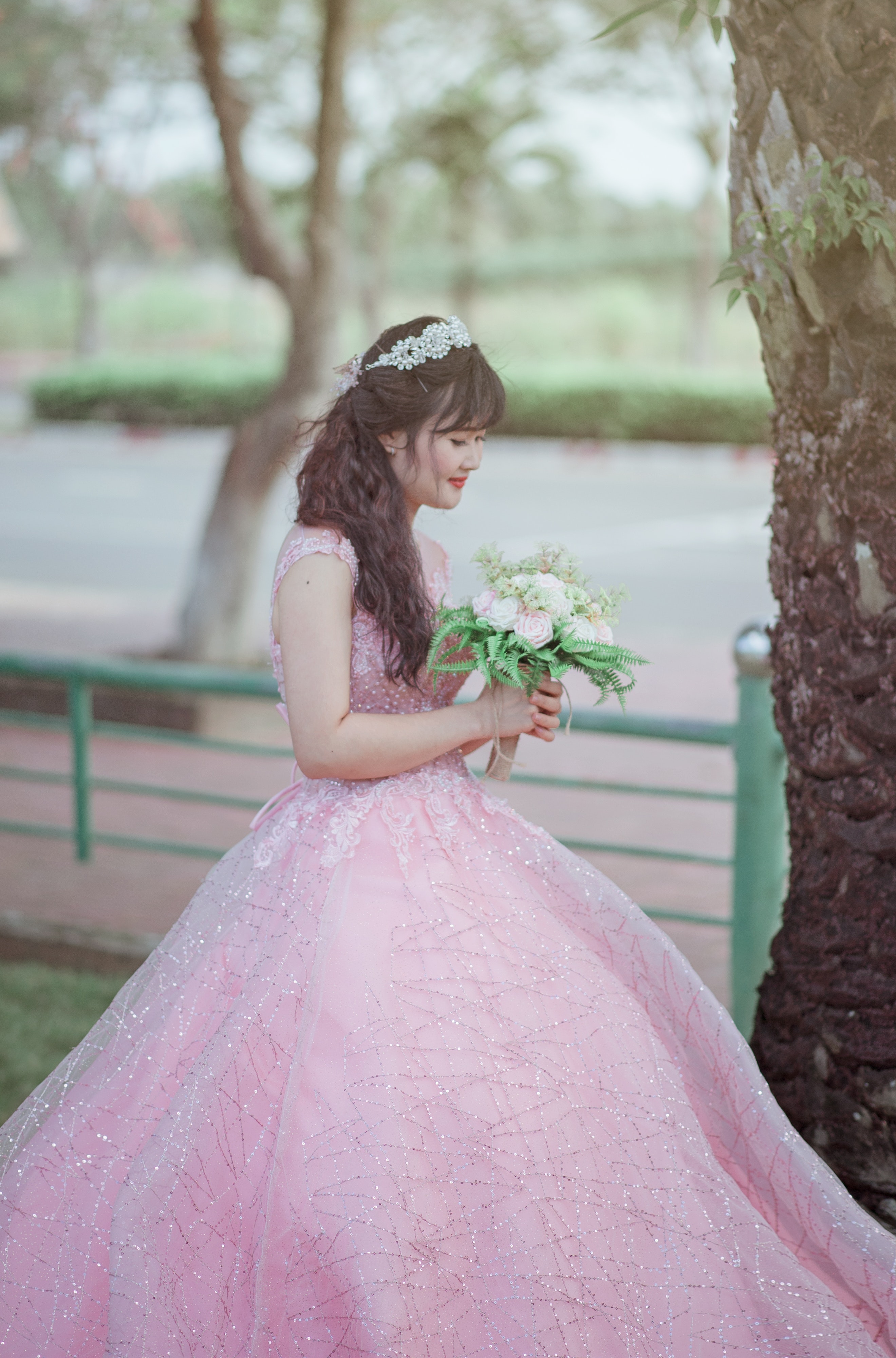 Woman in pink sleeveless gown photo