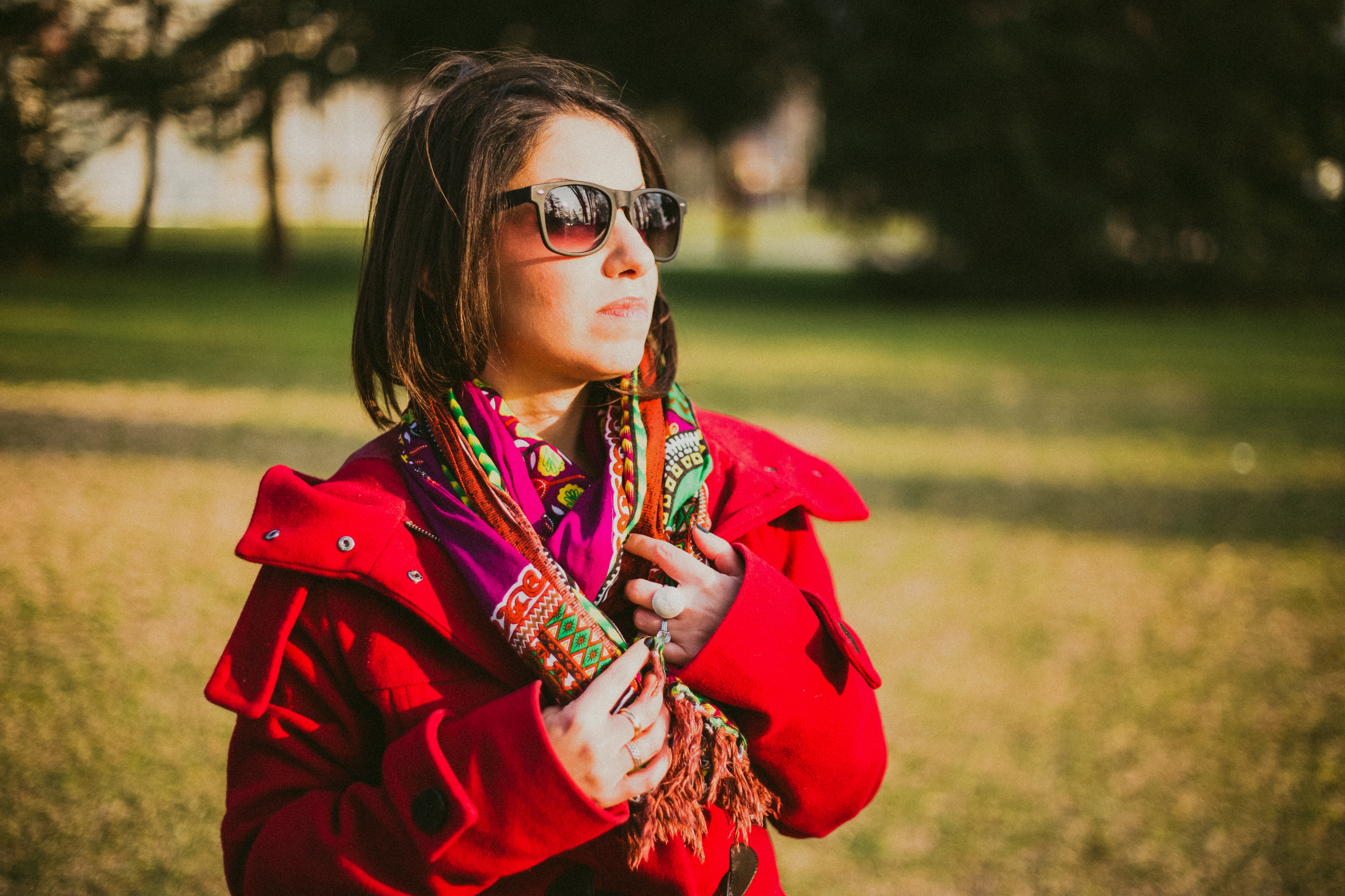 Woman in red coat with black sunglasses photo